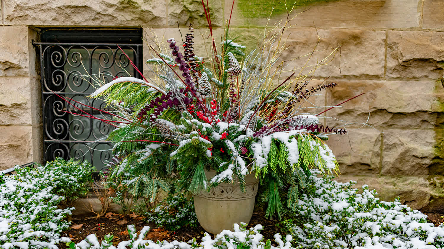 Christmas holiday planter outside home