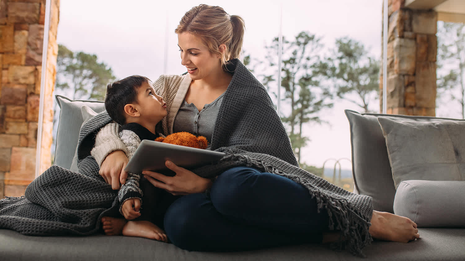 woman cozy at home with her son
