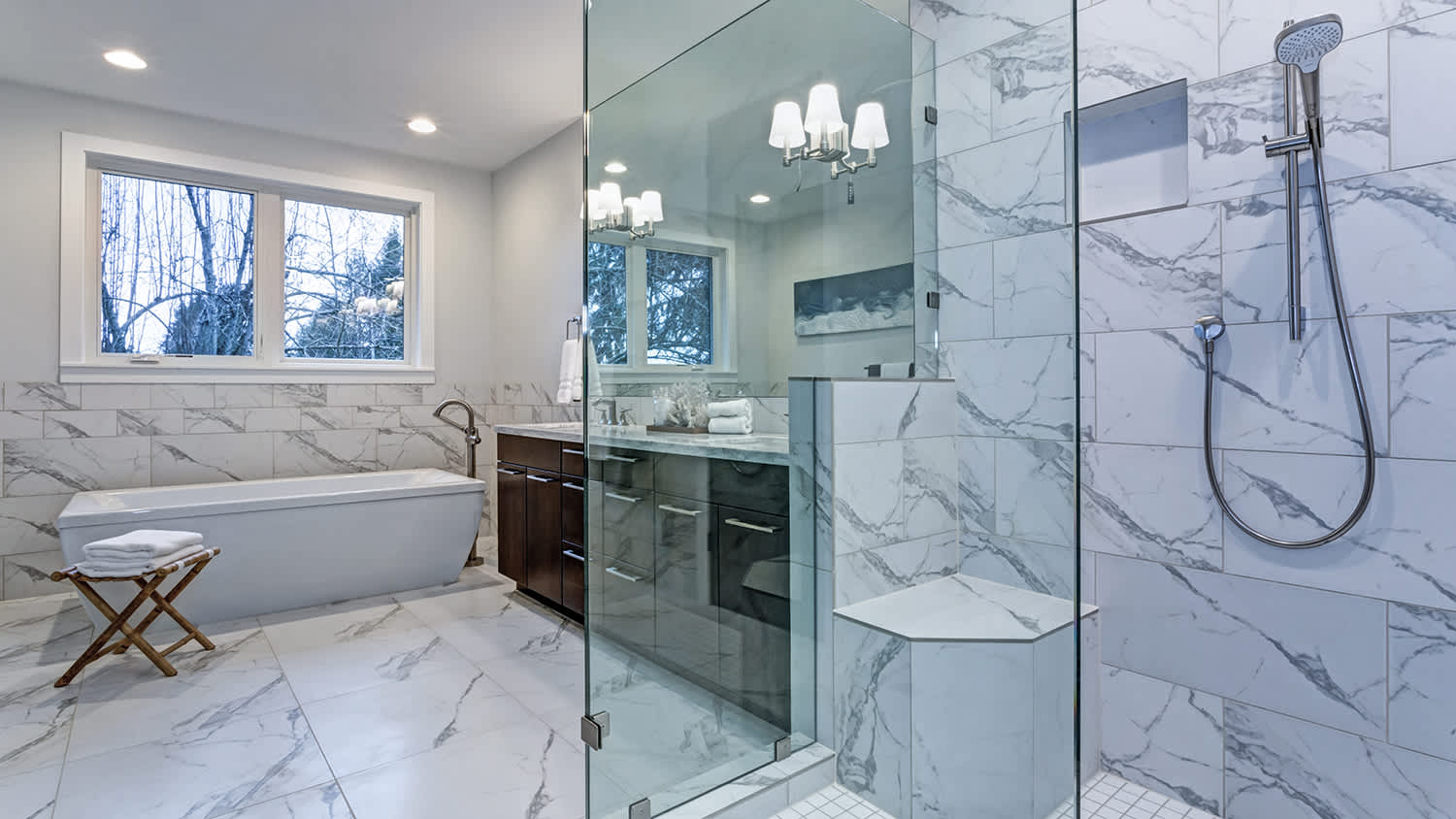 large marble bathroom with shower and tub