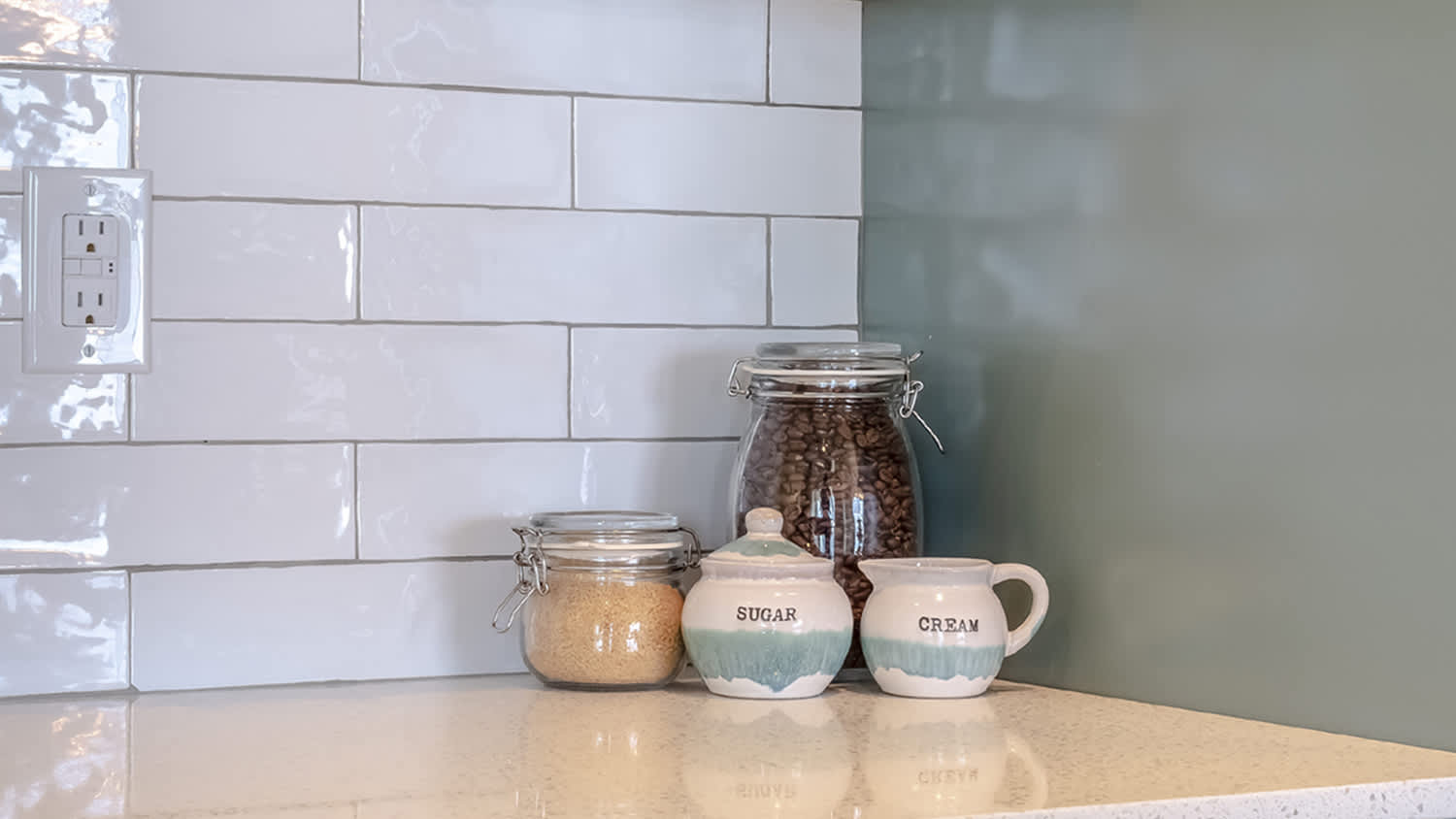 countertop with coffee, sugar and cream