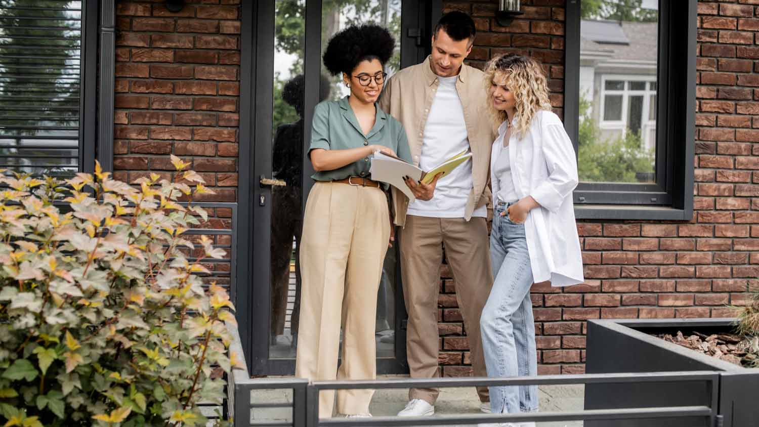 agent giving couple home appraisal