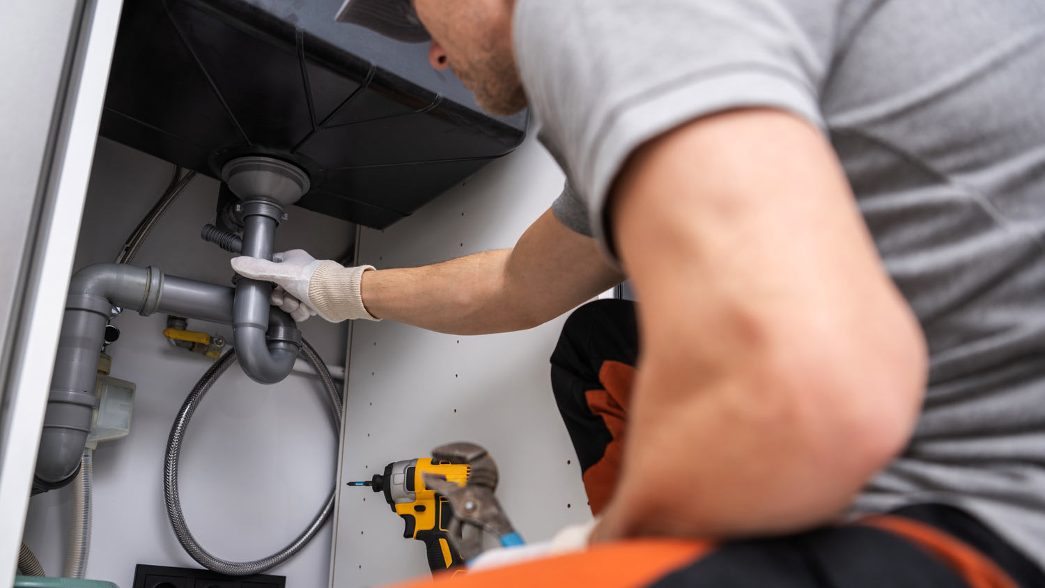 contractor working on sink leak