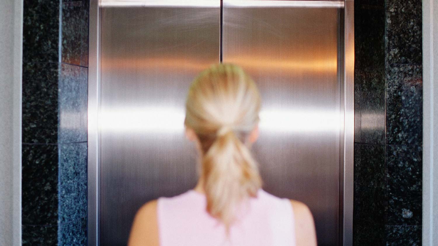 A woman waiting for the elevator