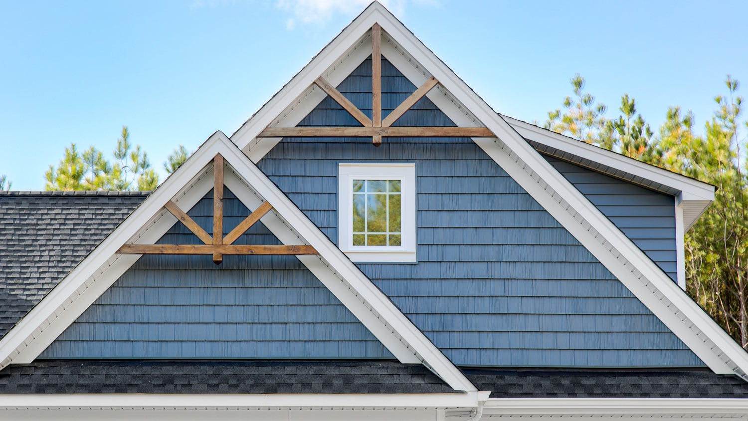 Blue House Gable Roof With Wooden Trusses