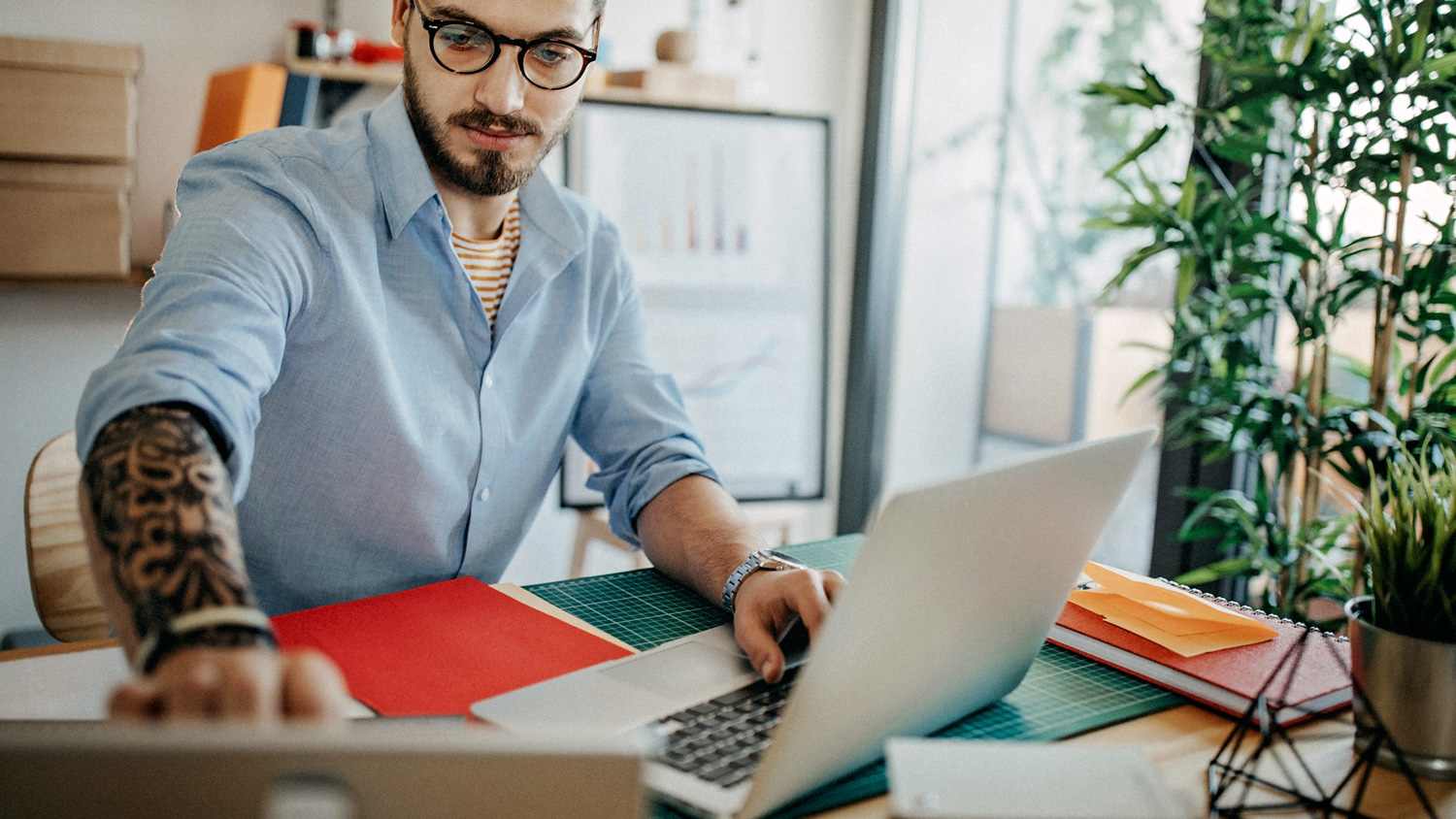 Man on computer at home desk