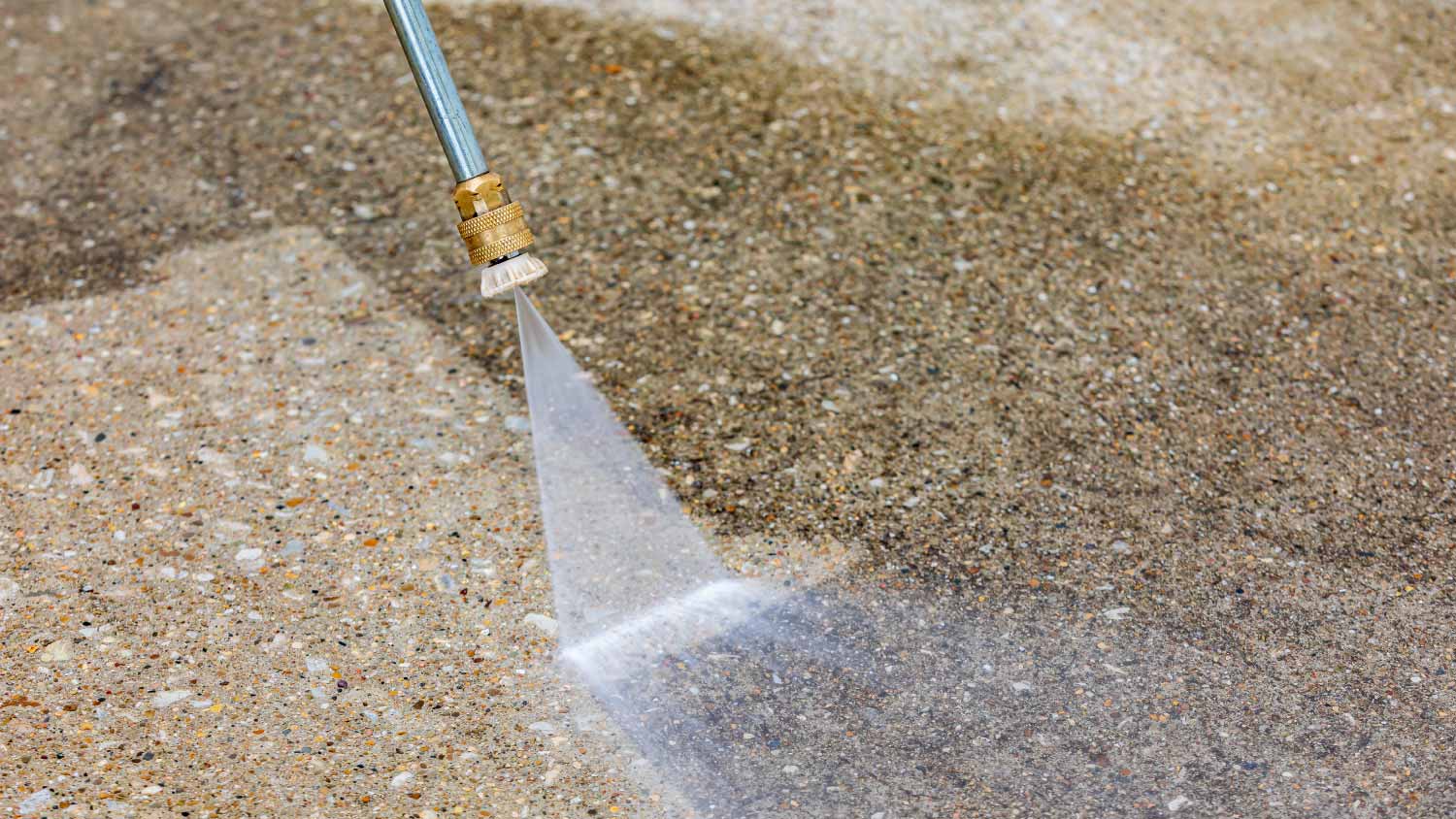 Pressure washing concrete driveway