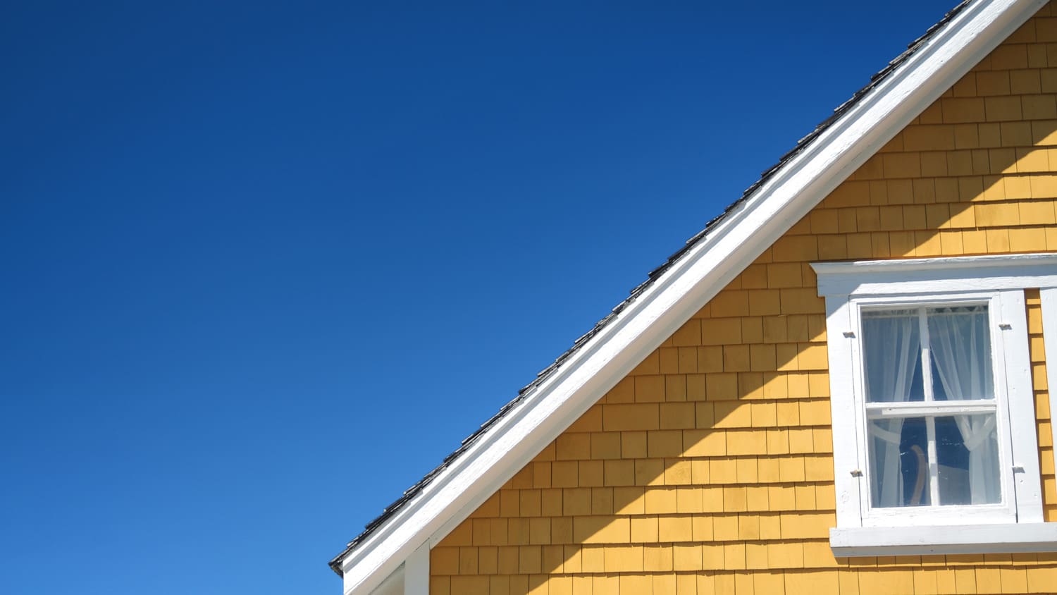 The architectural detail of a roofline on a home