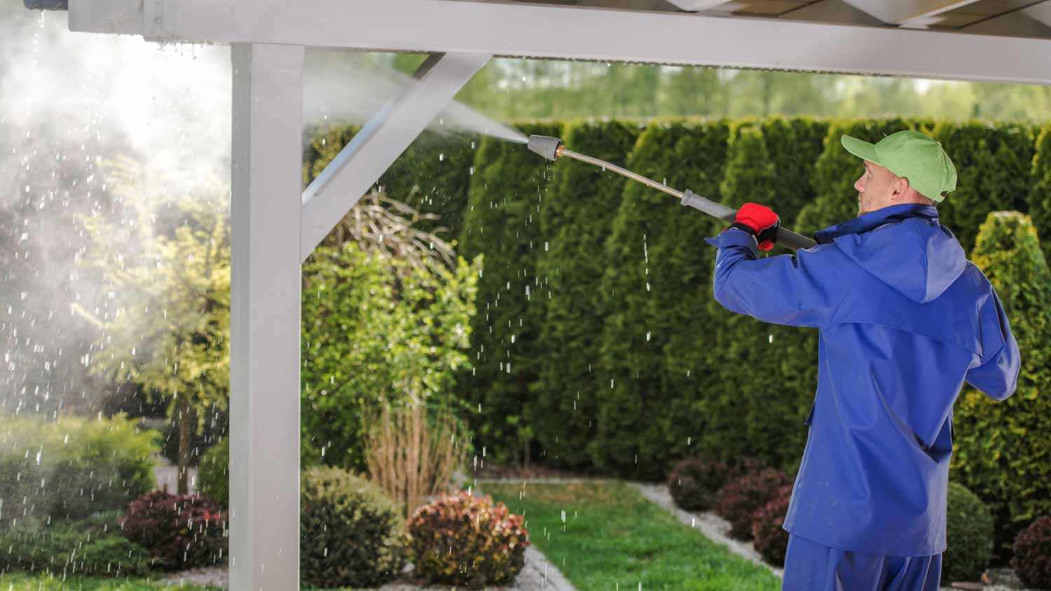 Man washing garden porch