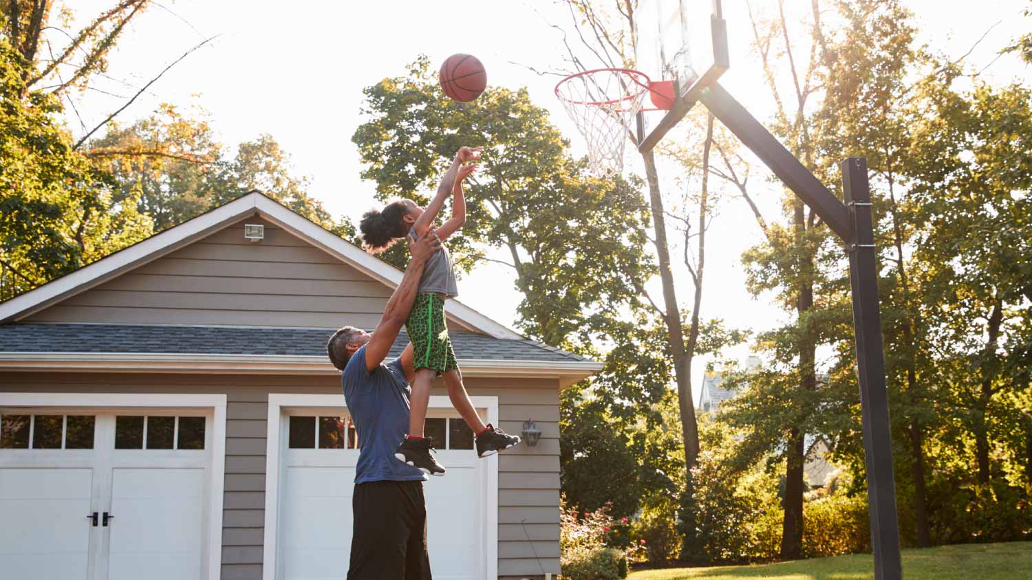 Father and son playing basketball