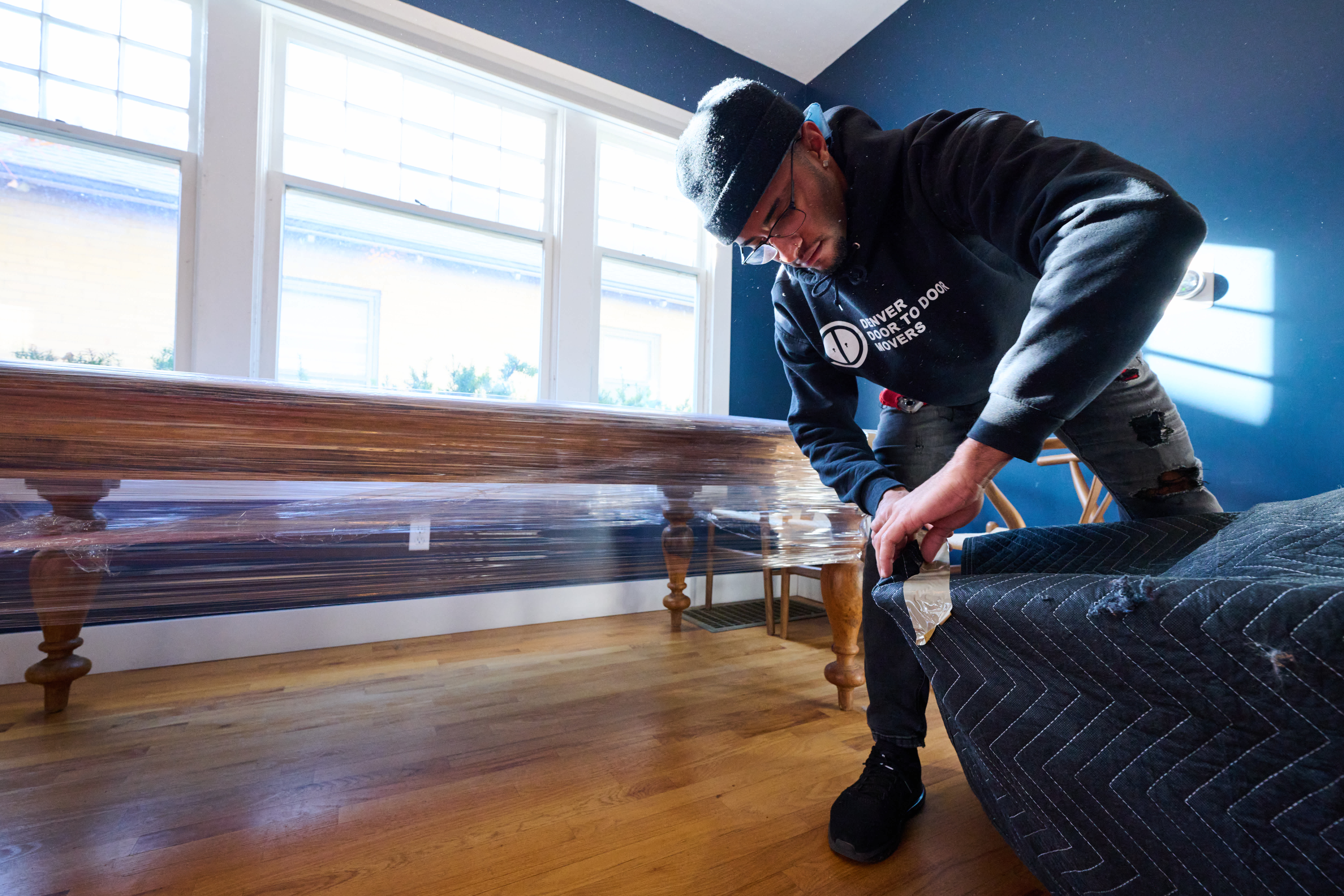 Mover packing up furniture
