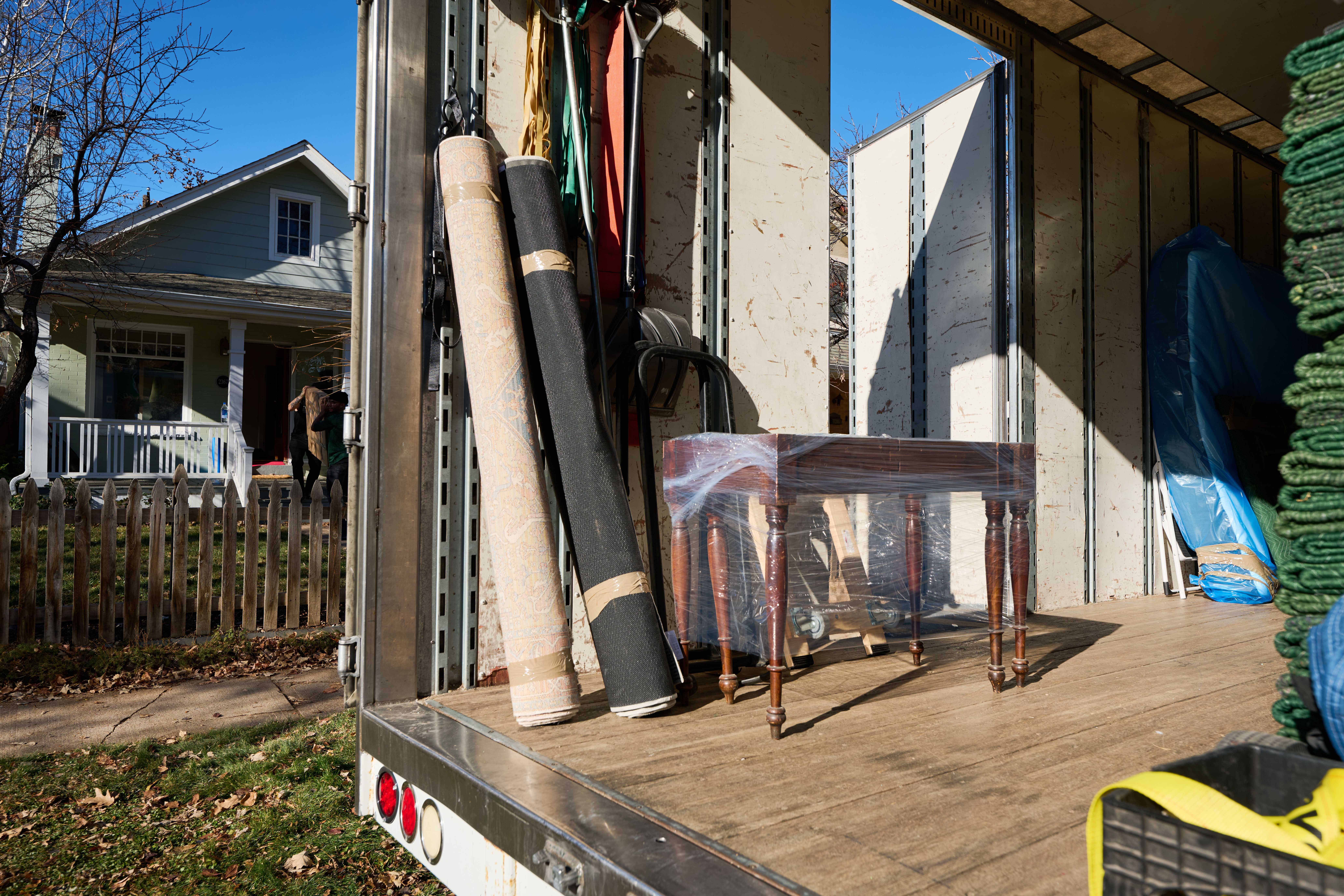 Rugs rolled up in a moving truck.