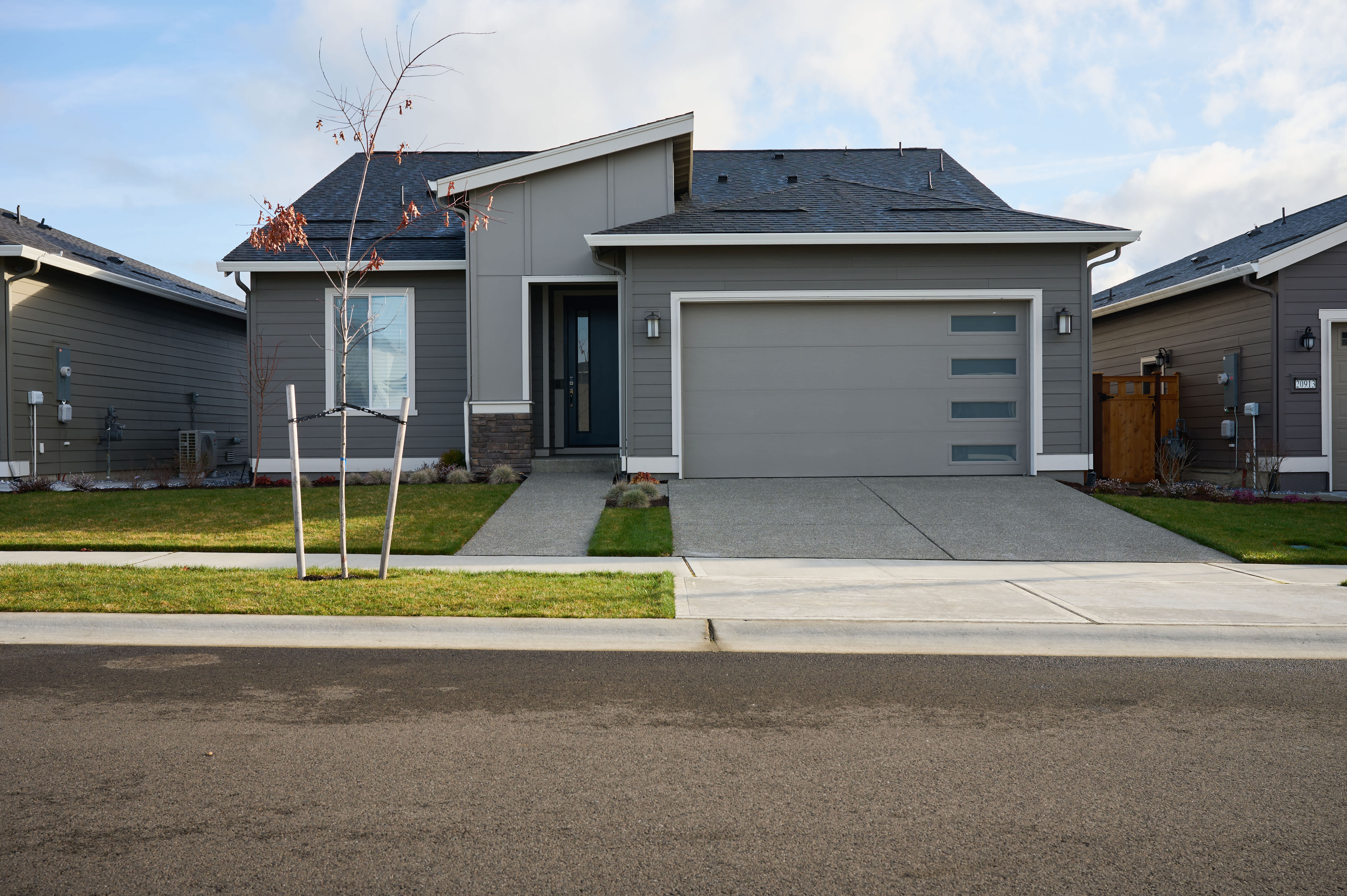Curb view of modern house.