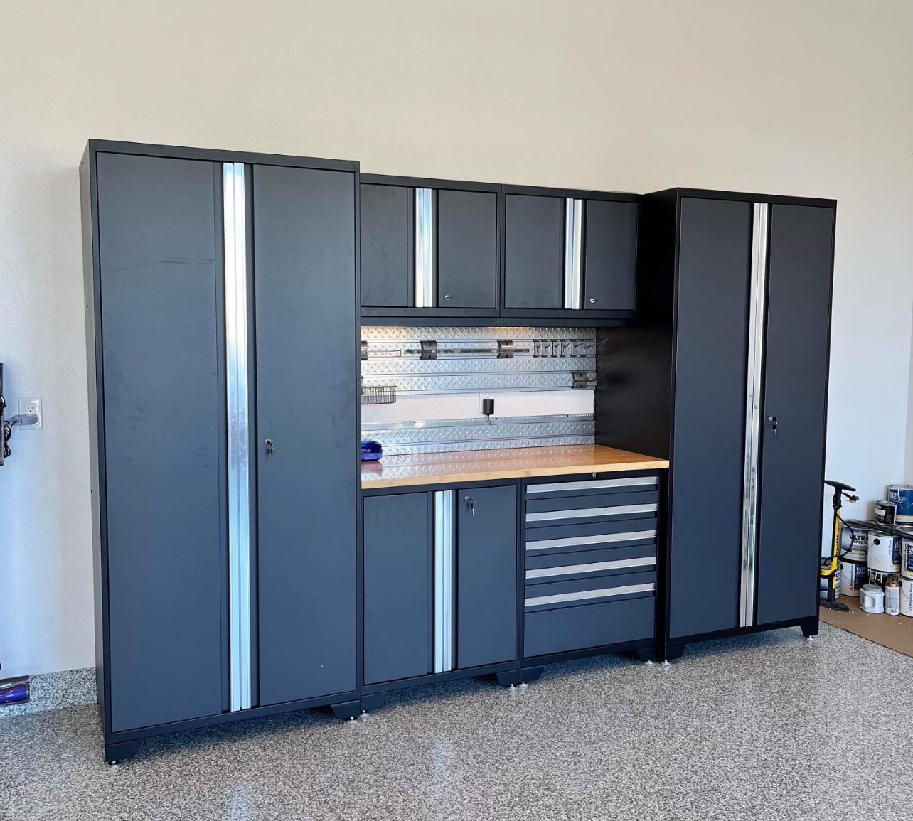 Vehicle parked in garage with workbench