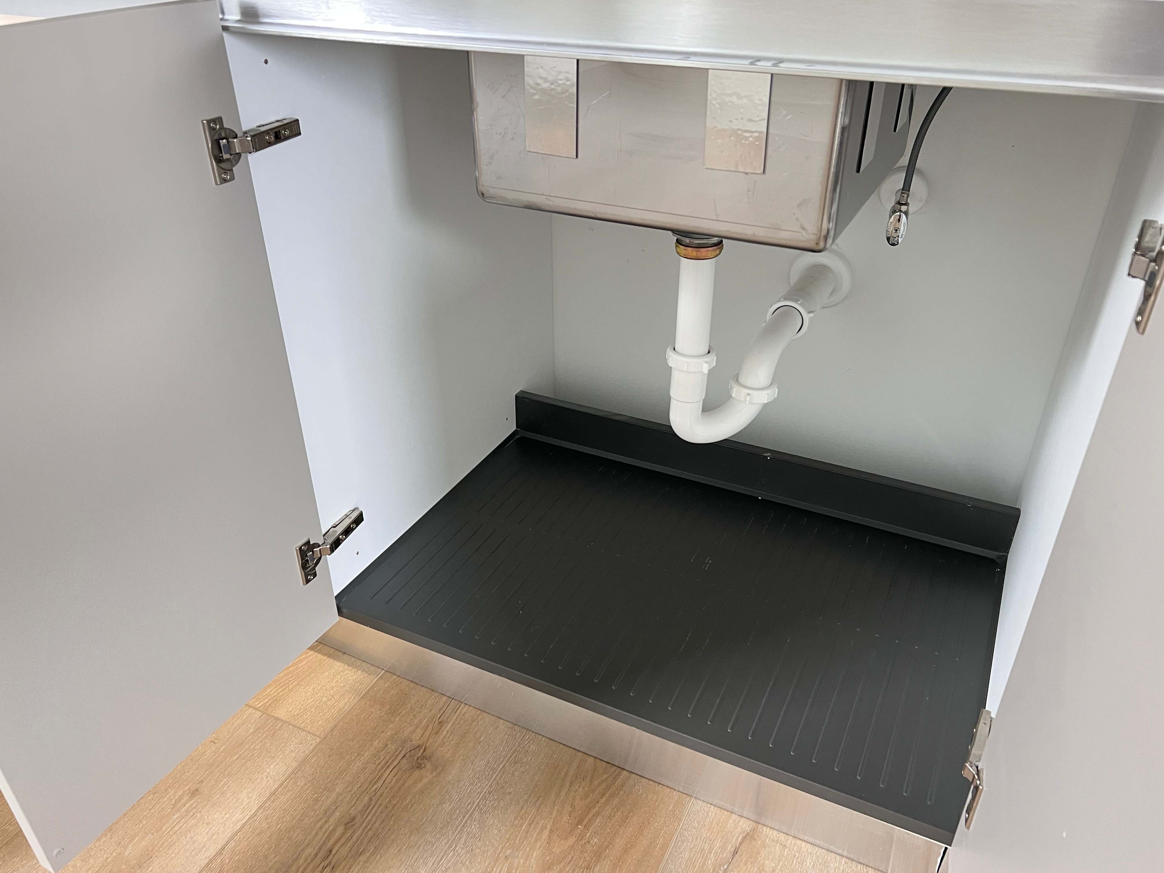 Kitchen sink fitted in custom cabinet