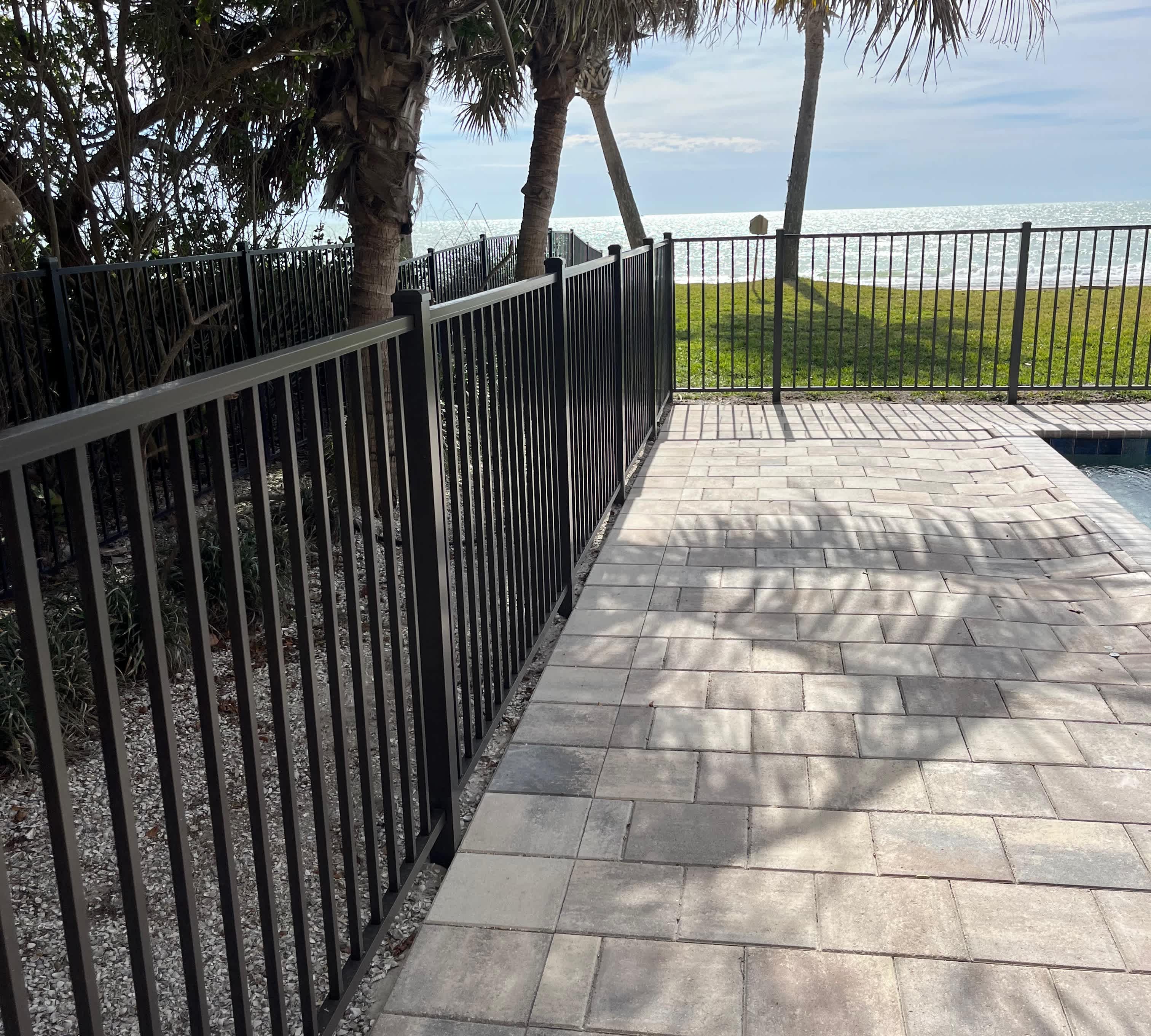 Black wooden fence, including different tones of black paint