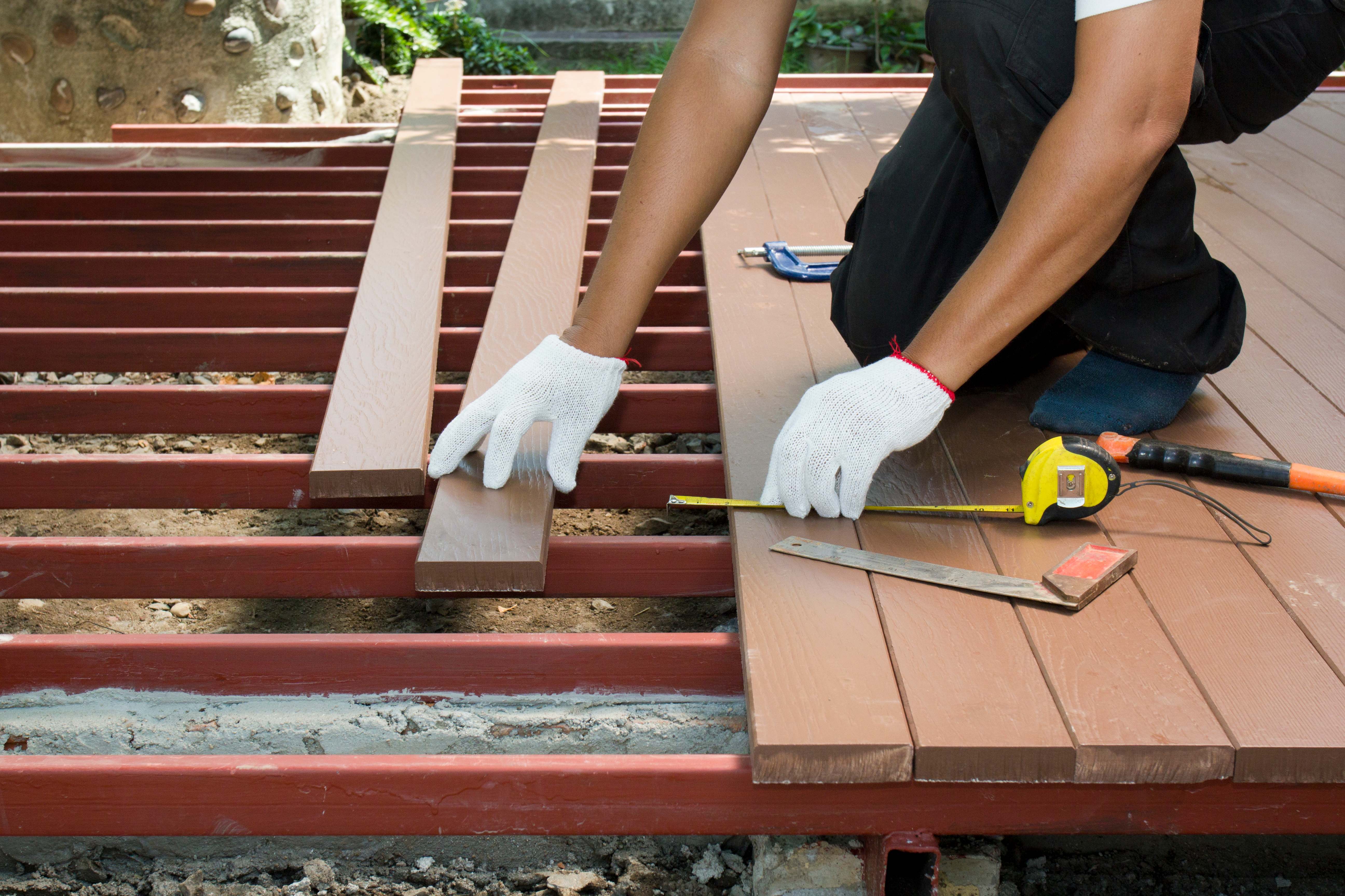 Worker installing an outdoor patio