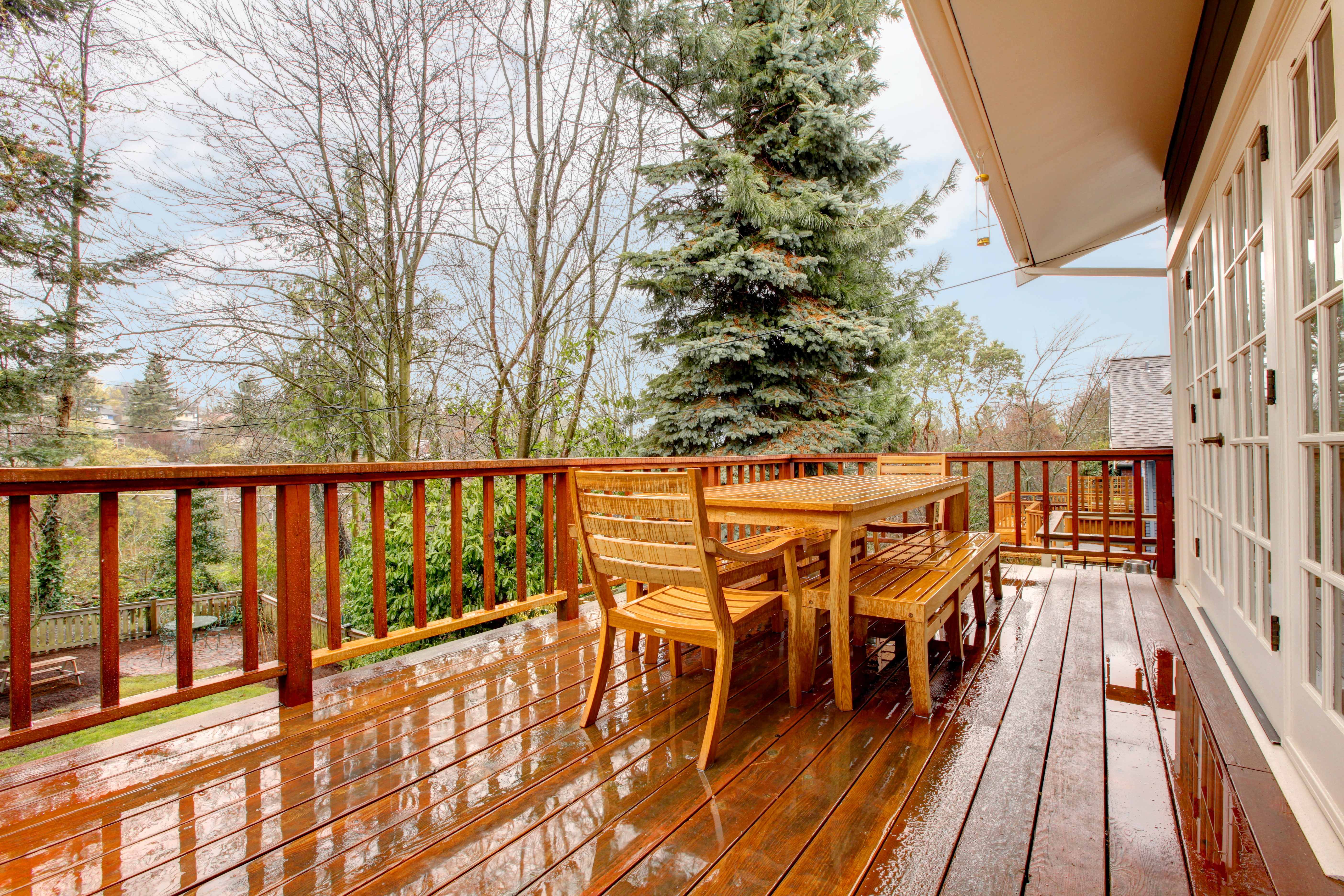 Wet wooden deck with outdoor furniture