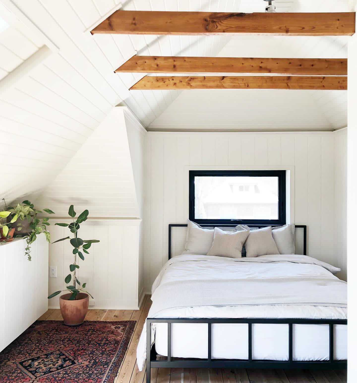 White bedroom with upholstered headboard