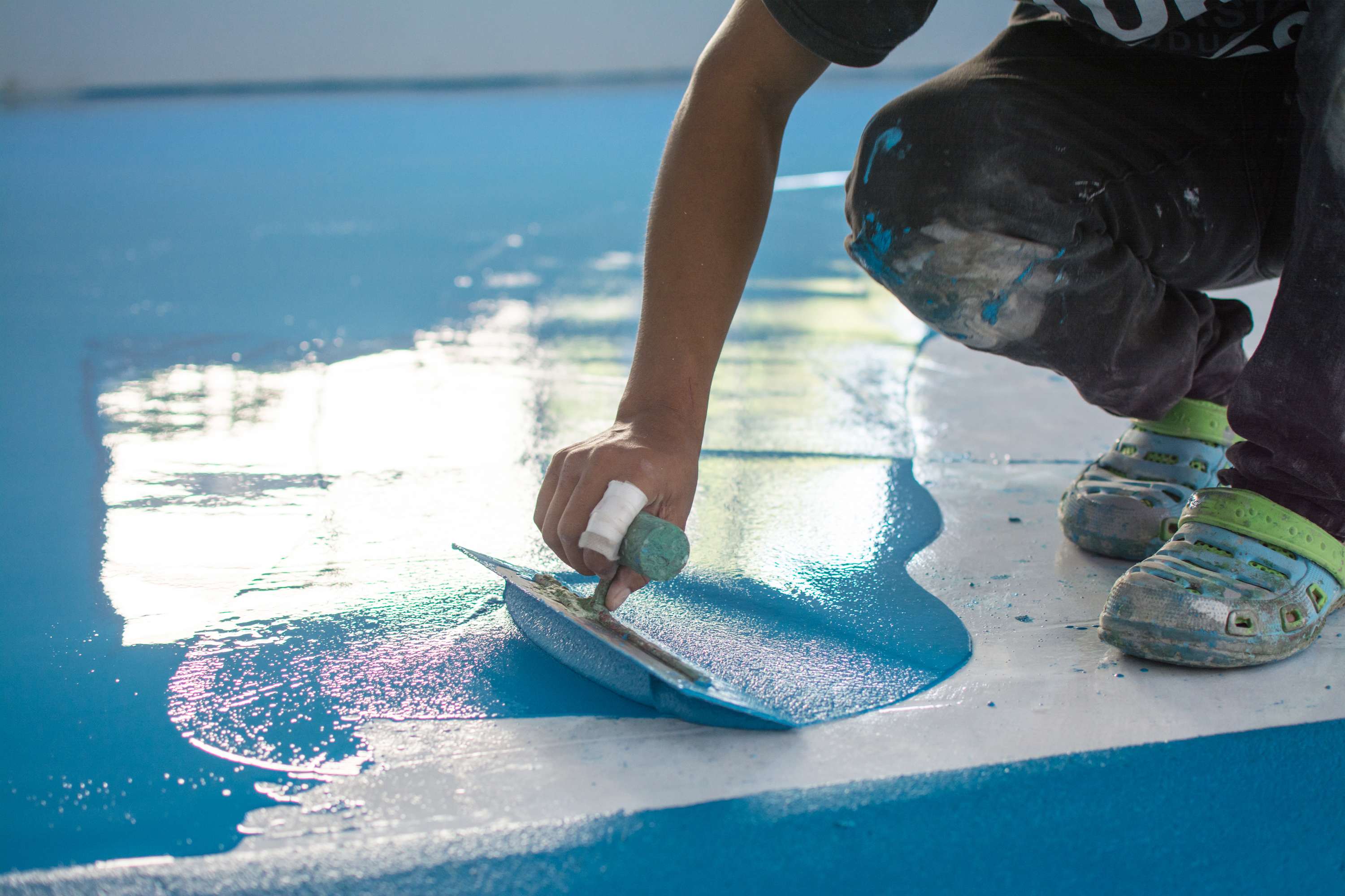 Epoxy resin layer applied over a concrete floor