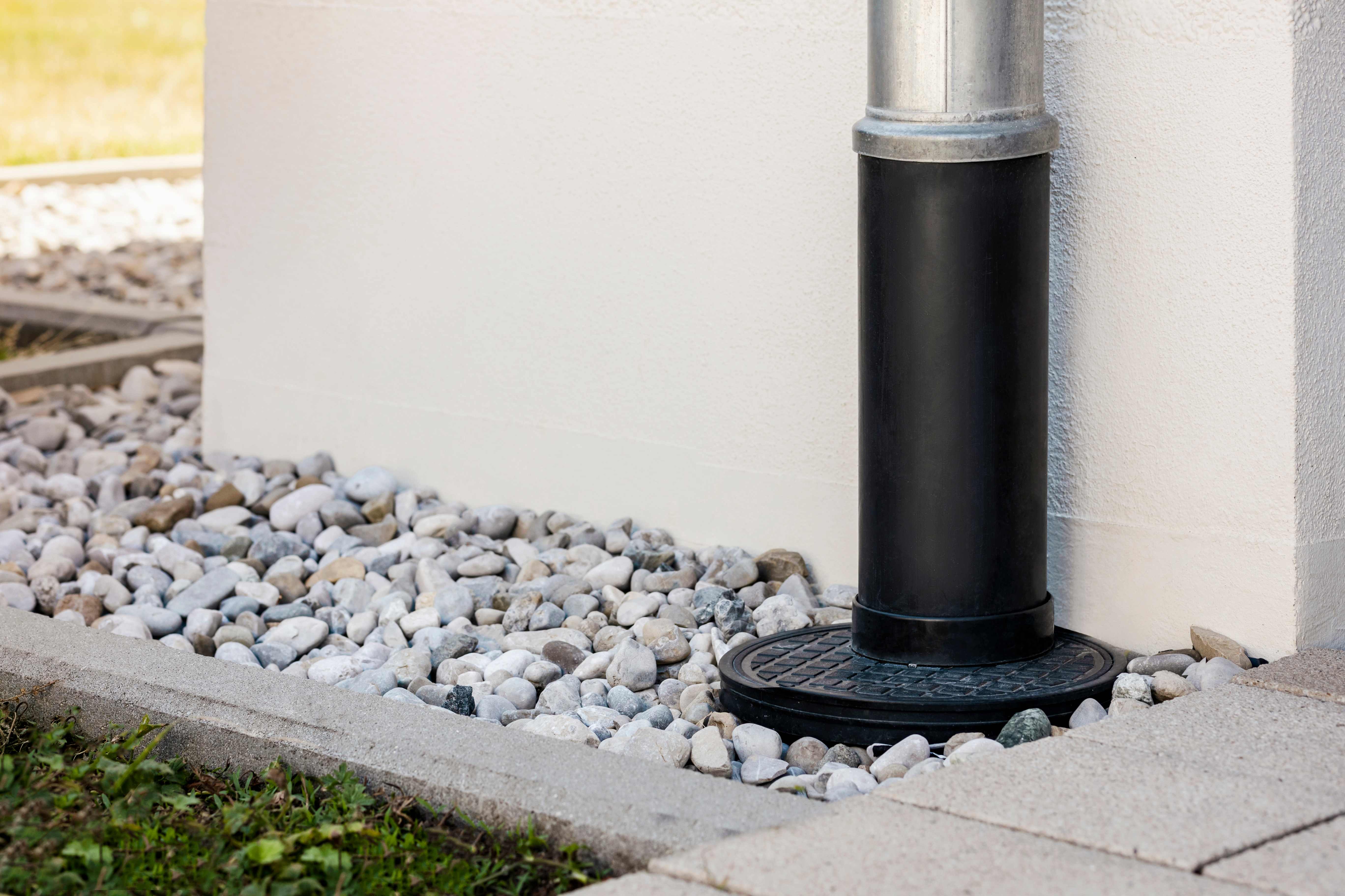 Gutter downspout and a French drain installed in the yard