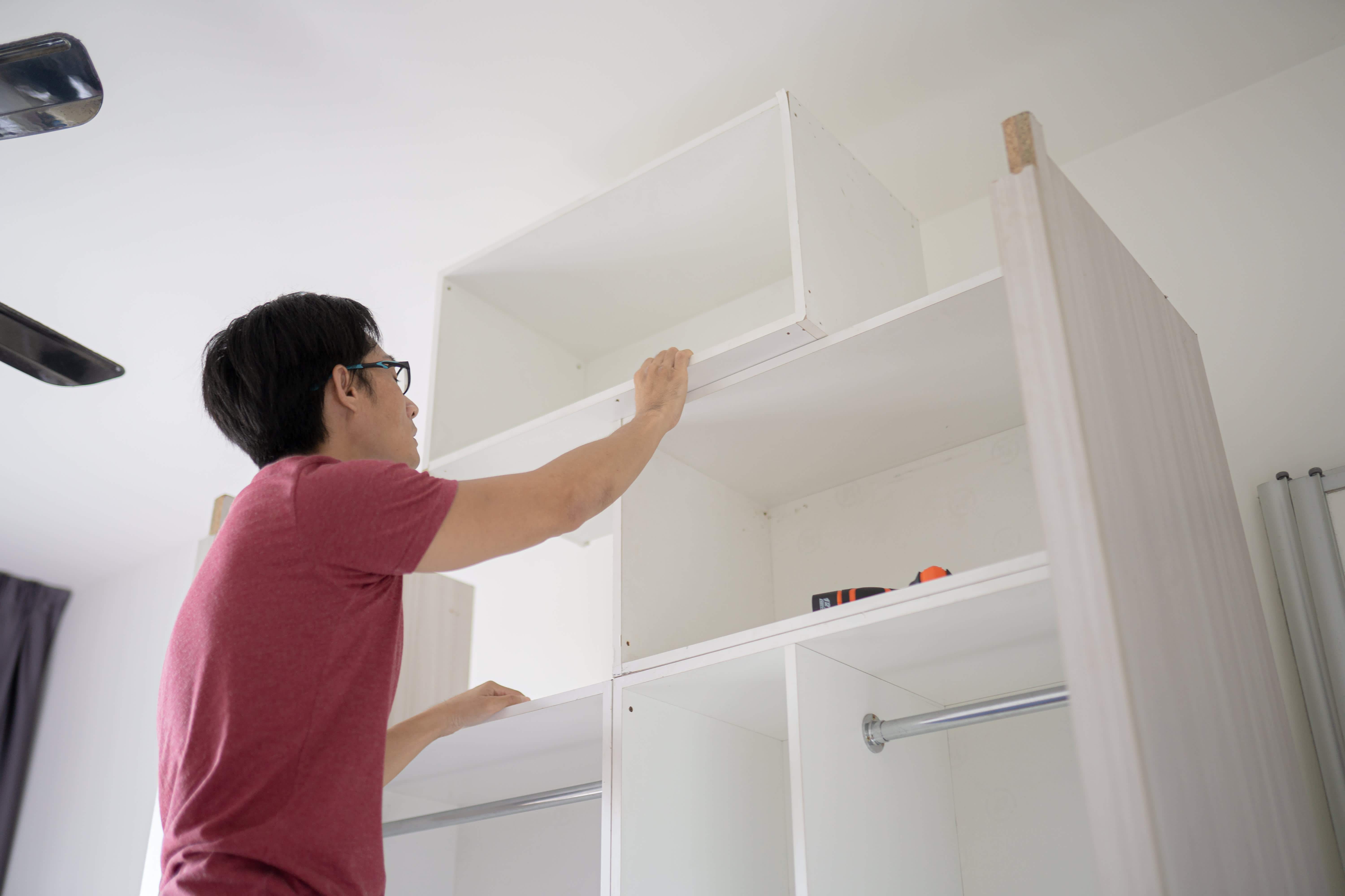 man assembling Wooden cabinet