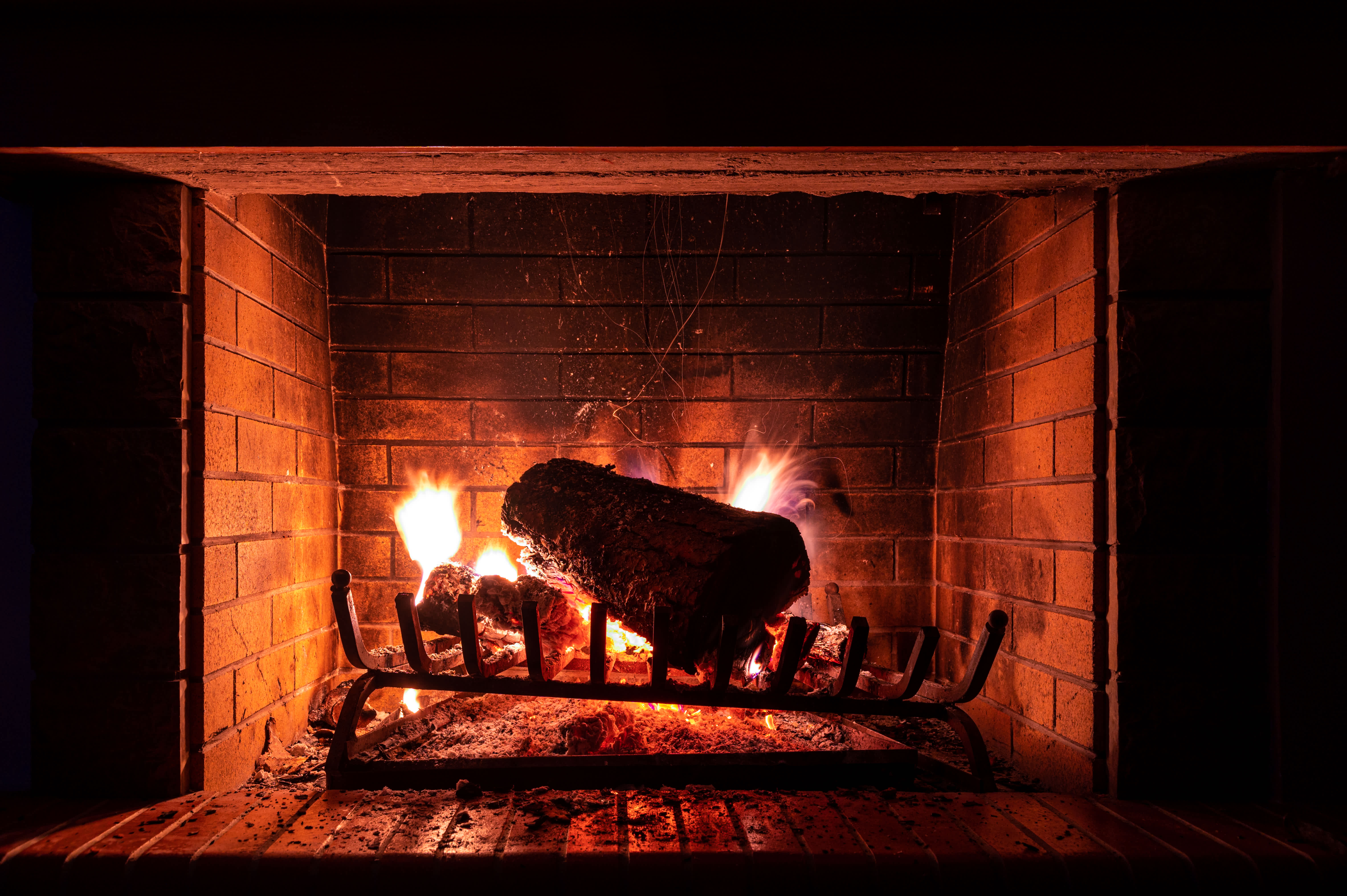 A log burning in a fireplace
