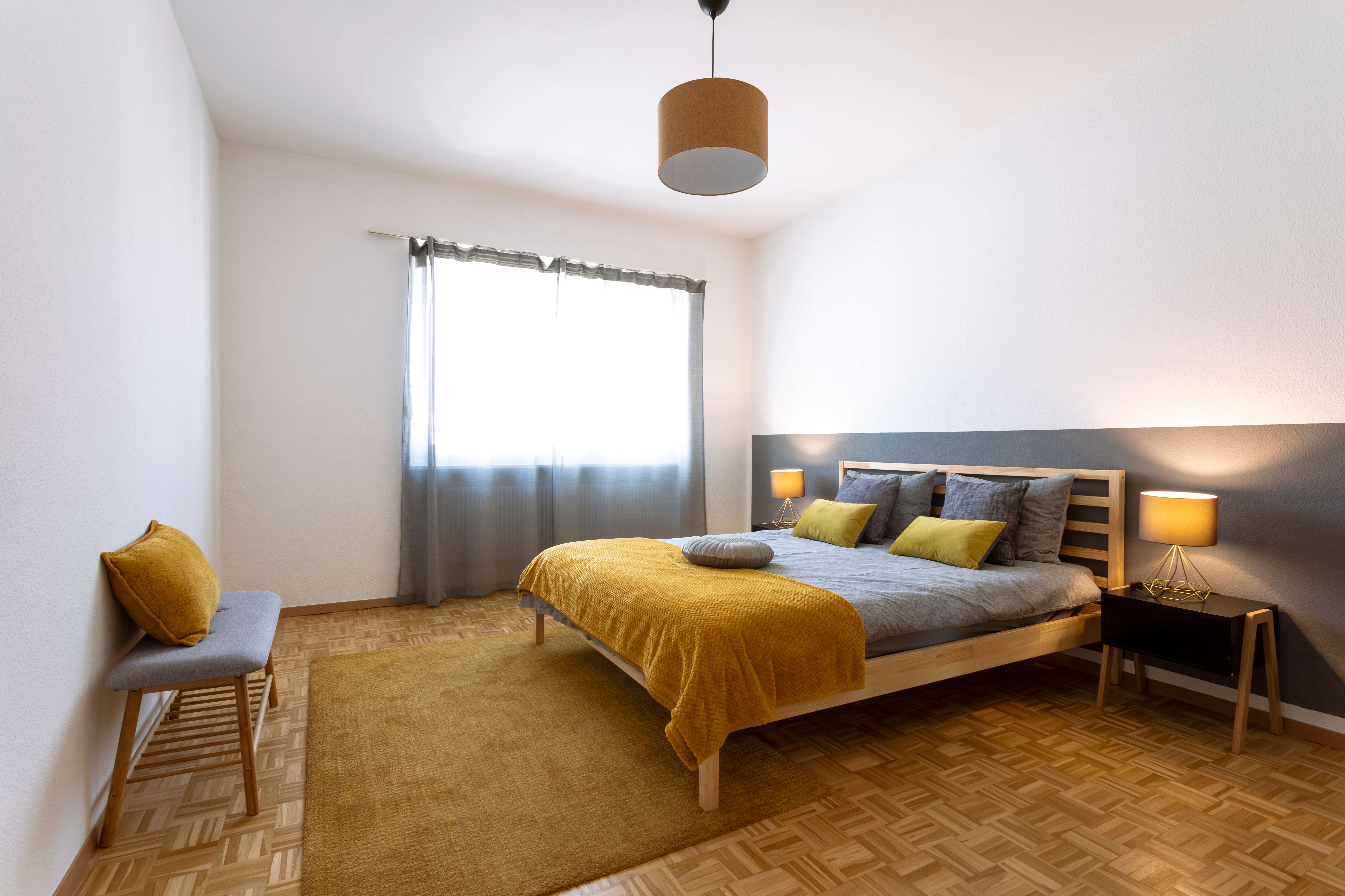 A minimalistic bedroom with drywalls