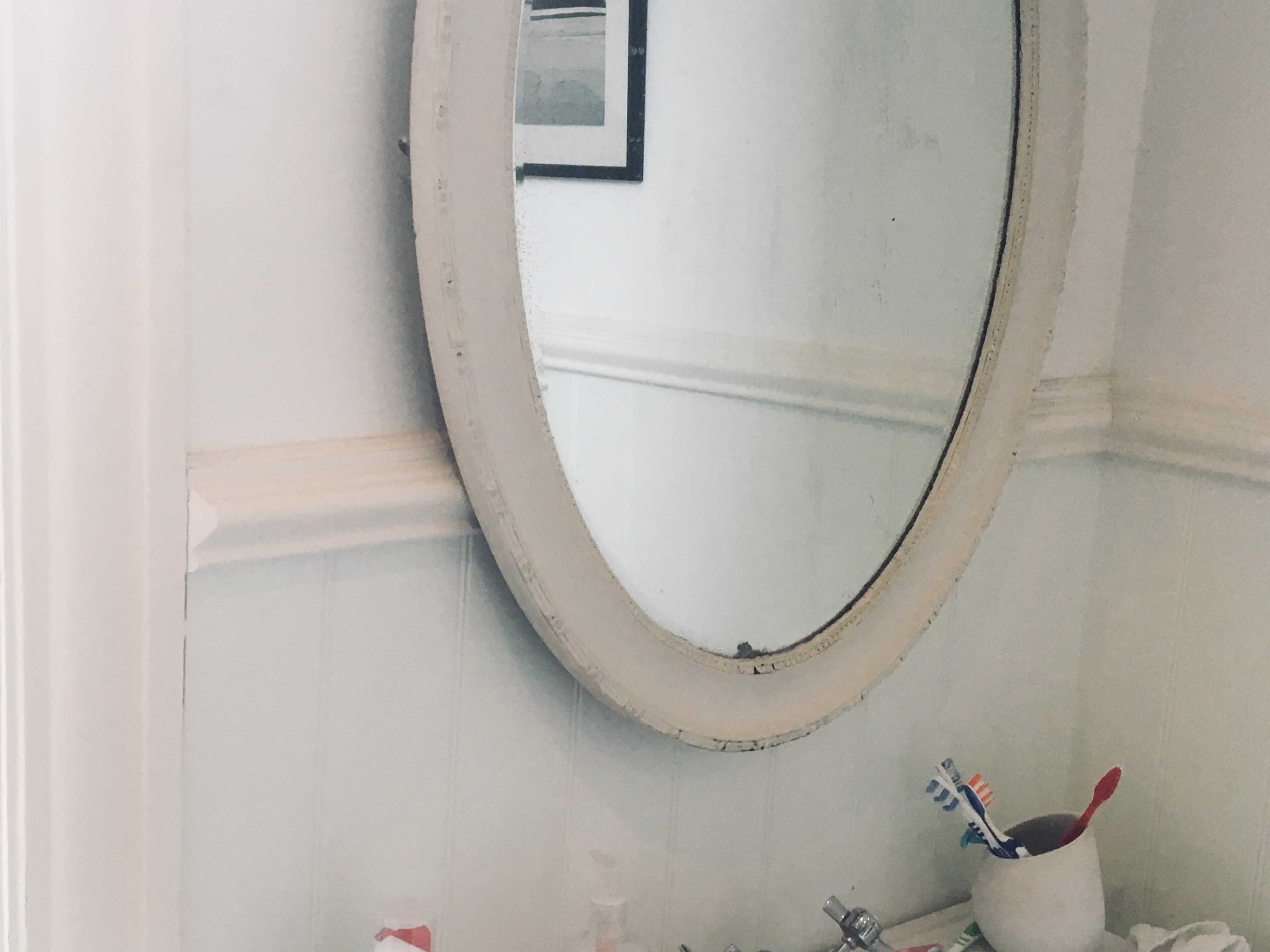 Mirror with sink and toothbrushes