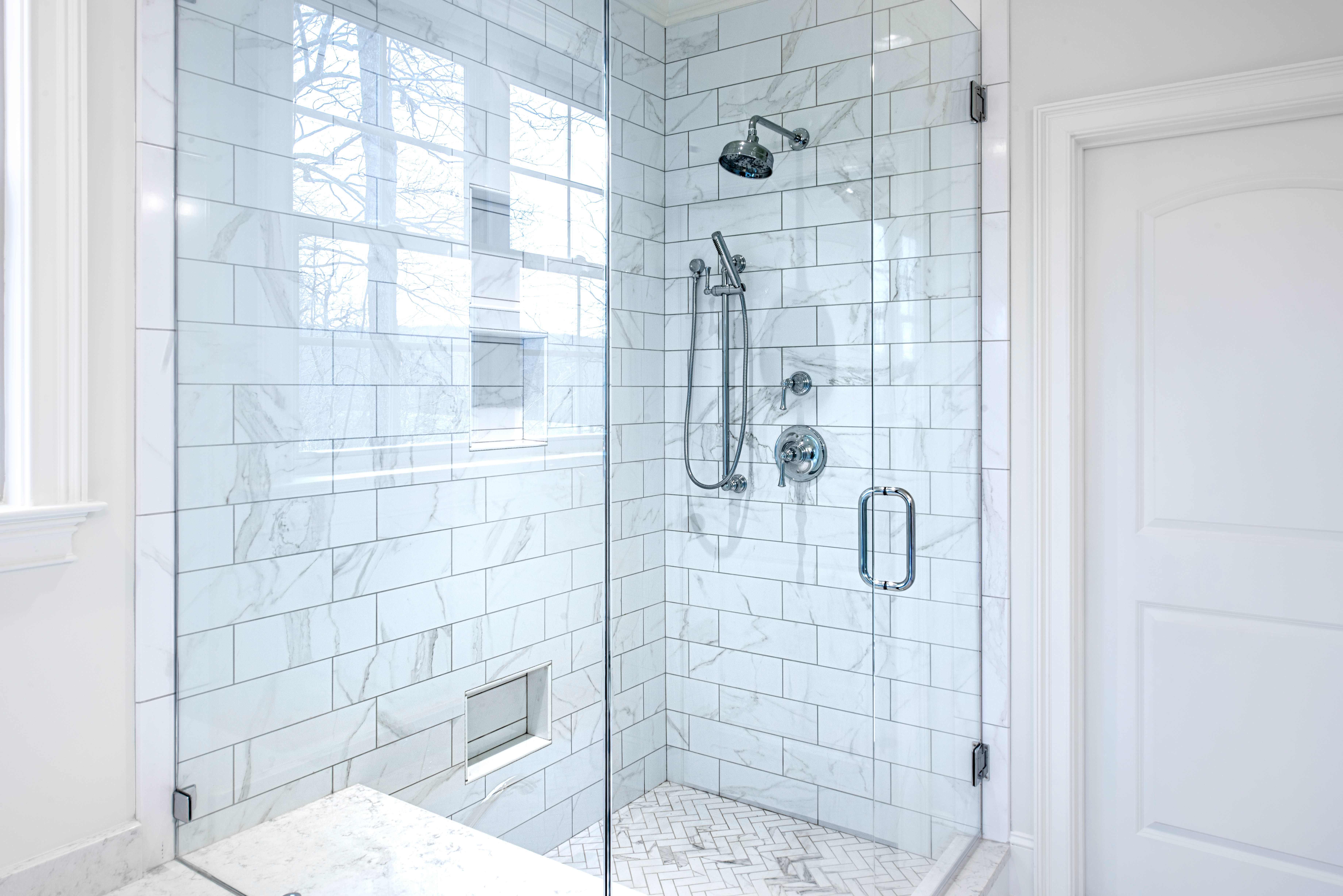 Modern bathroom with glass door.