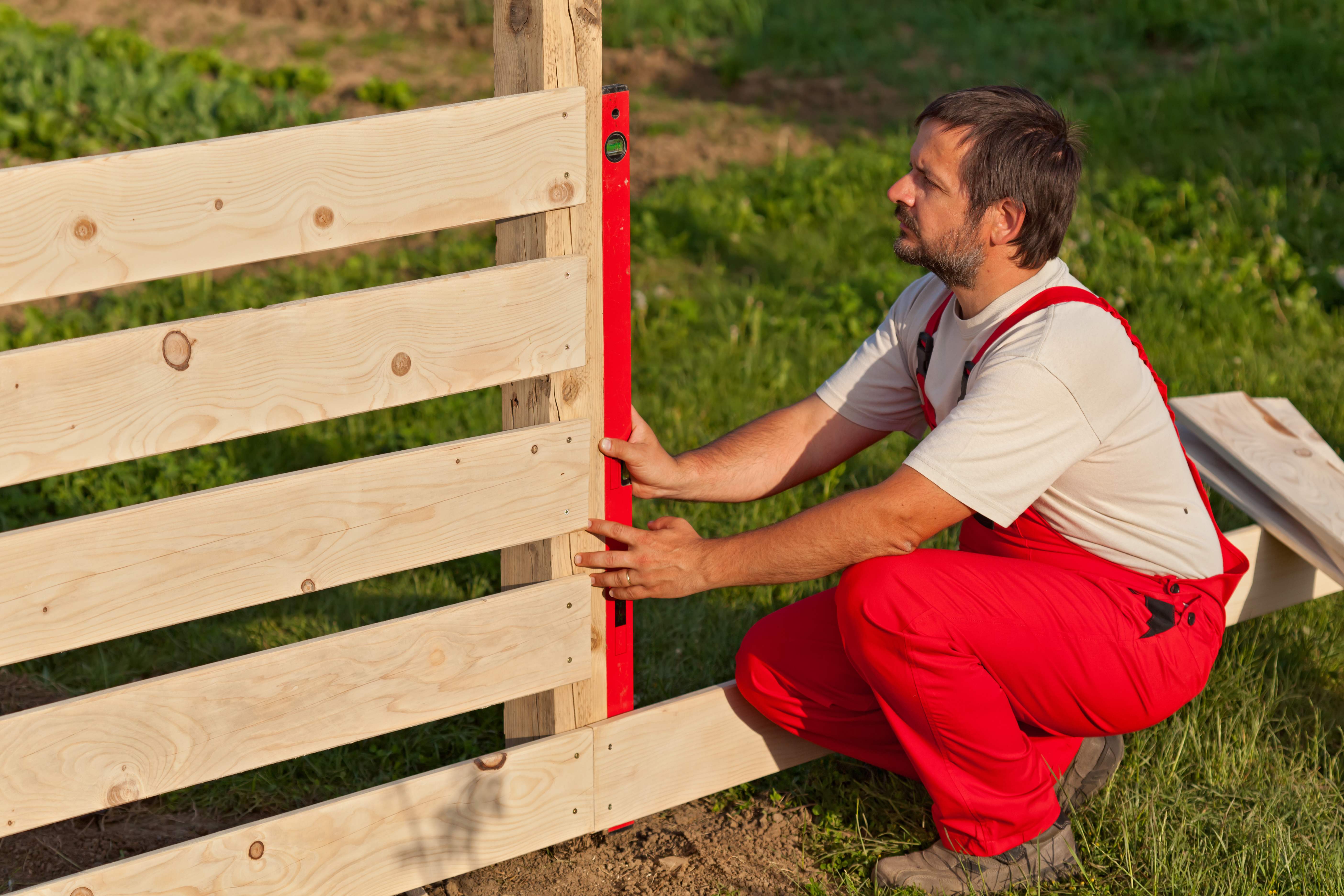 Man installing fence