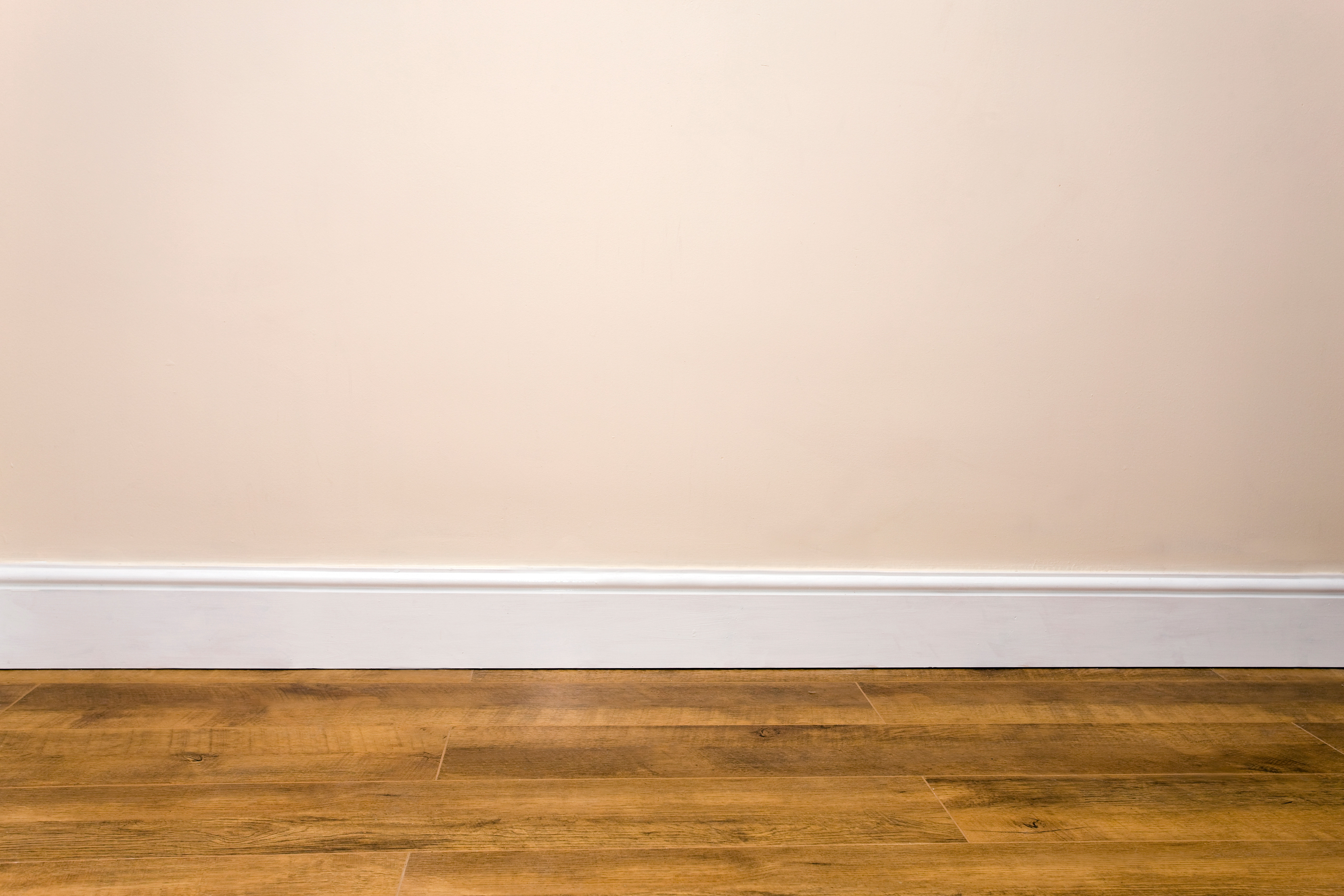 plain wall with a simple white baseboard