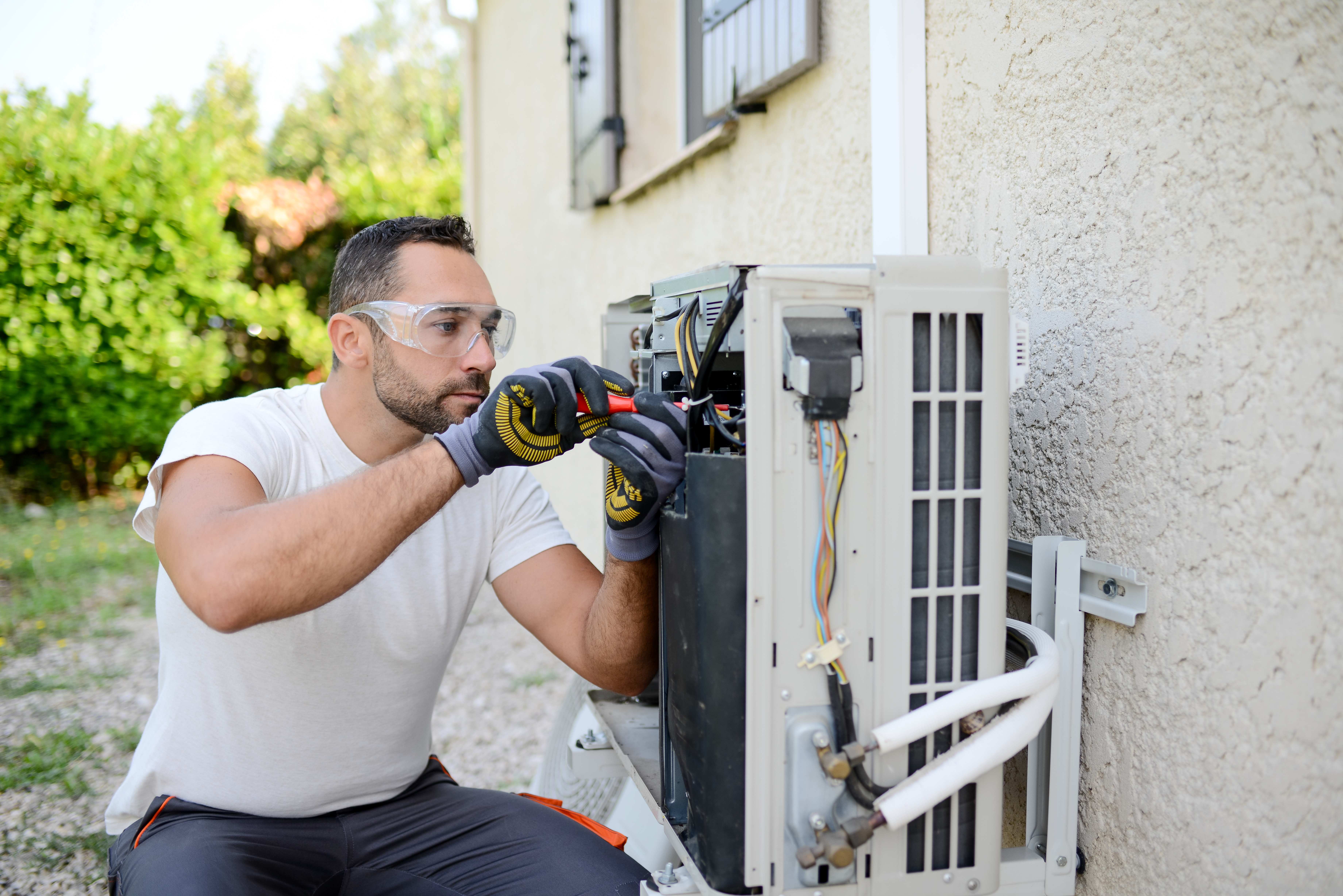 technician installing ac unit