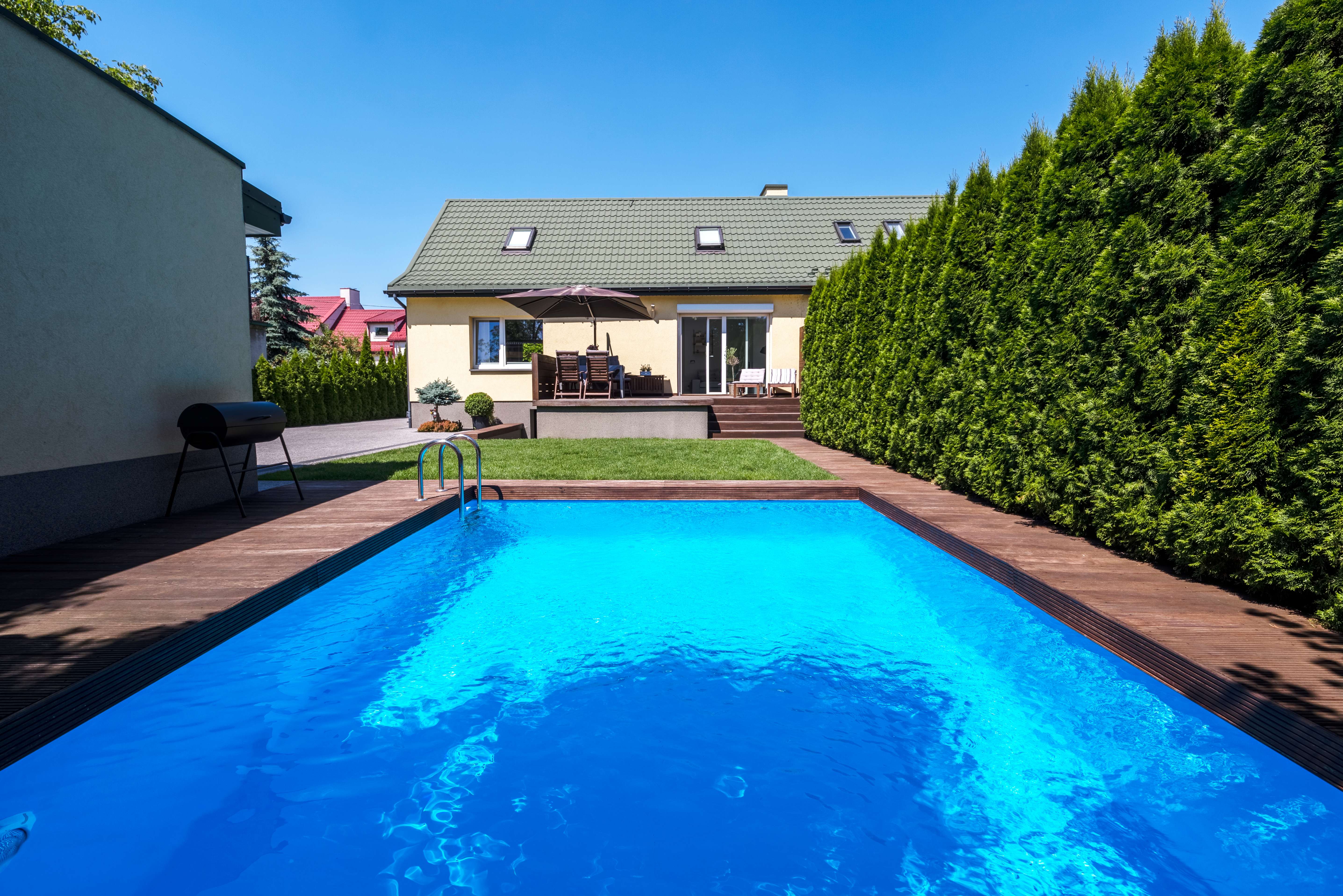 A pool in the backyard of a house