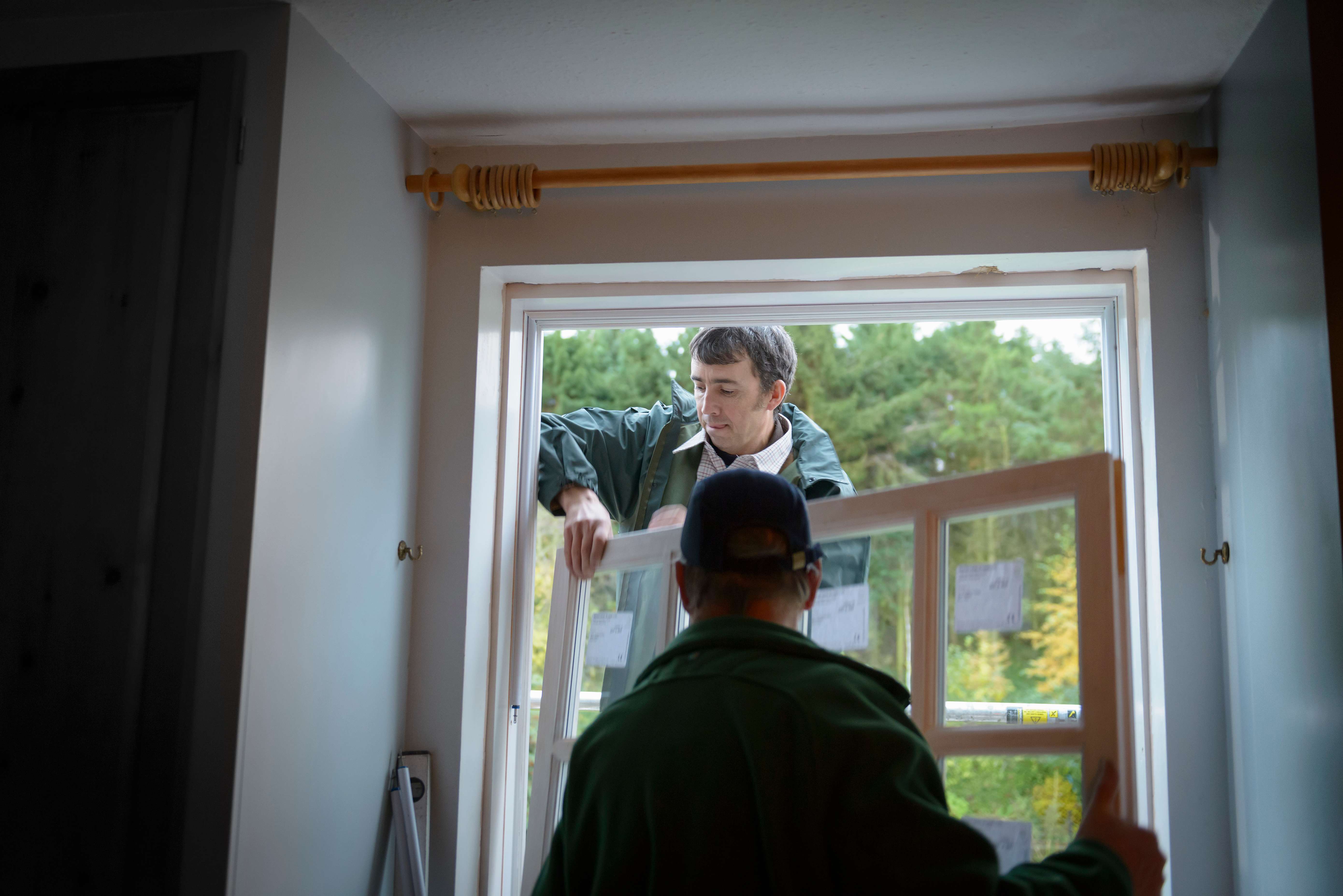 Workers installing new window