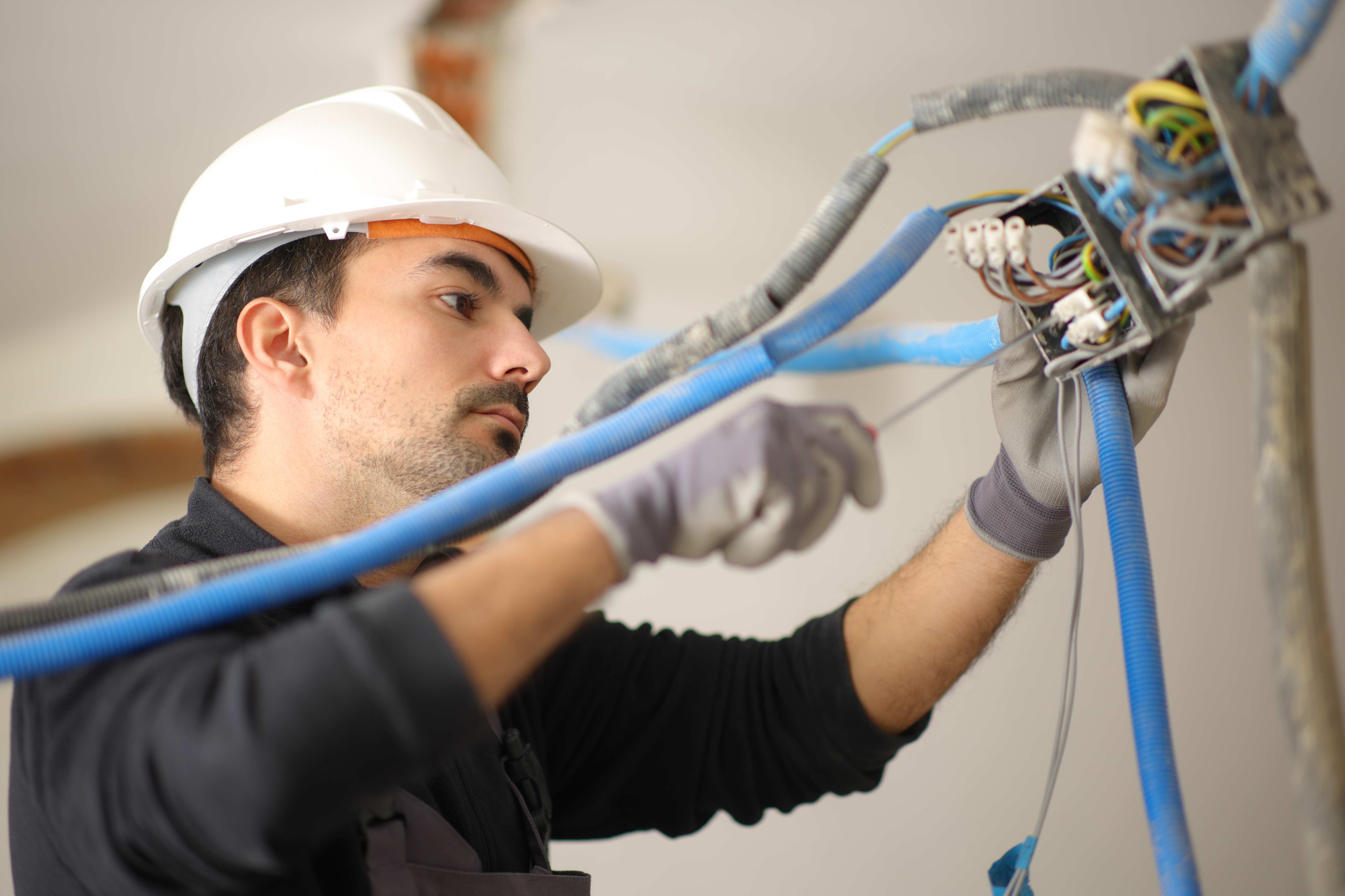 man rewiring house