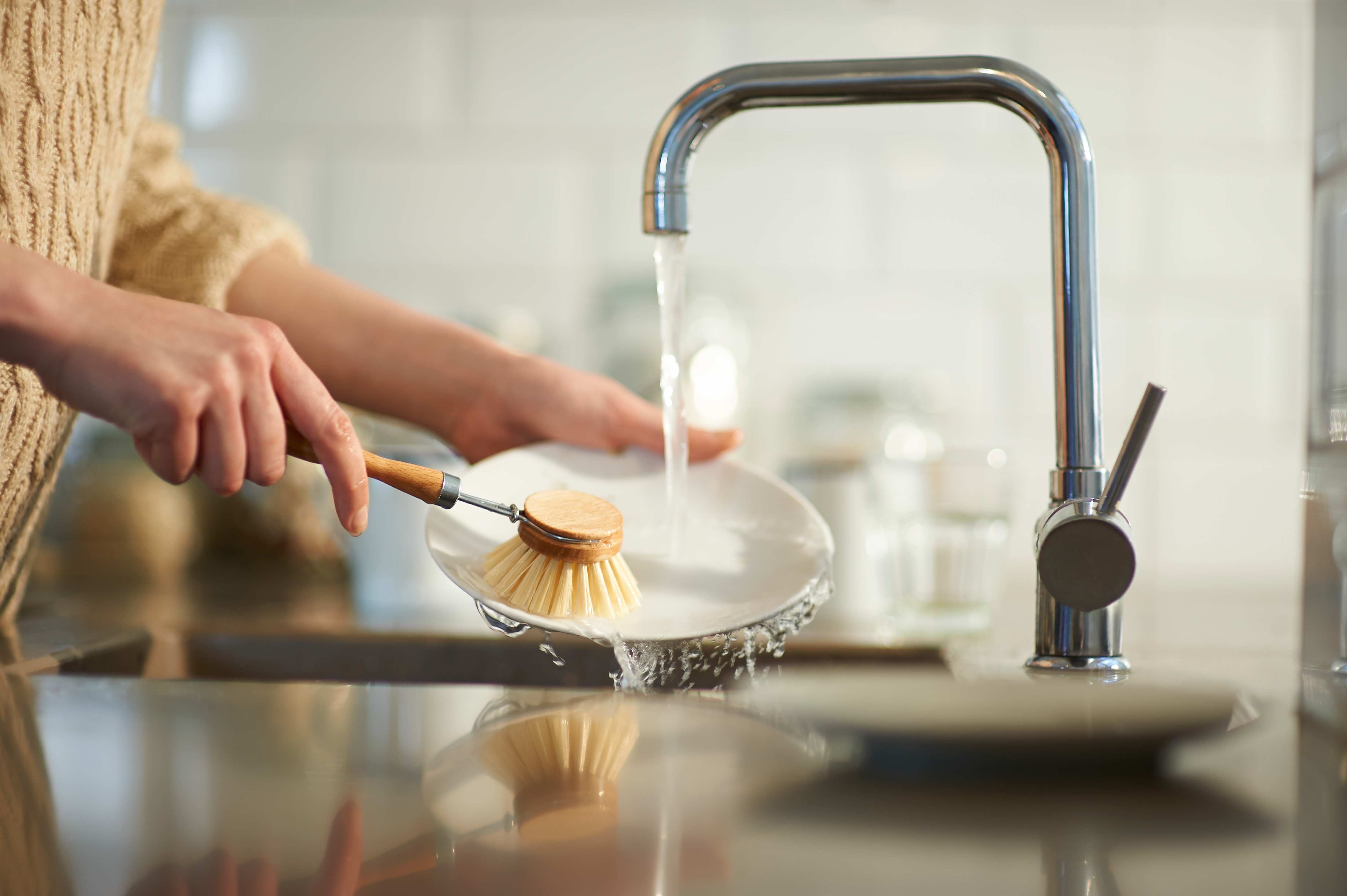 Woman washing dishes
