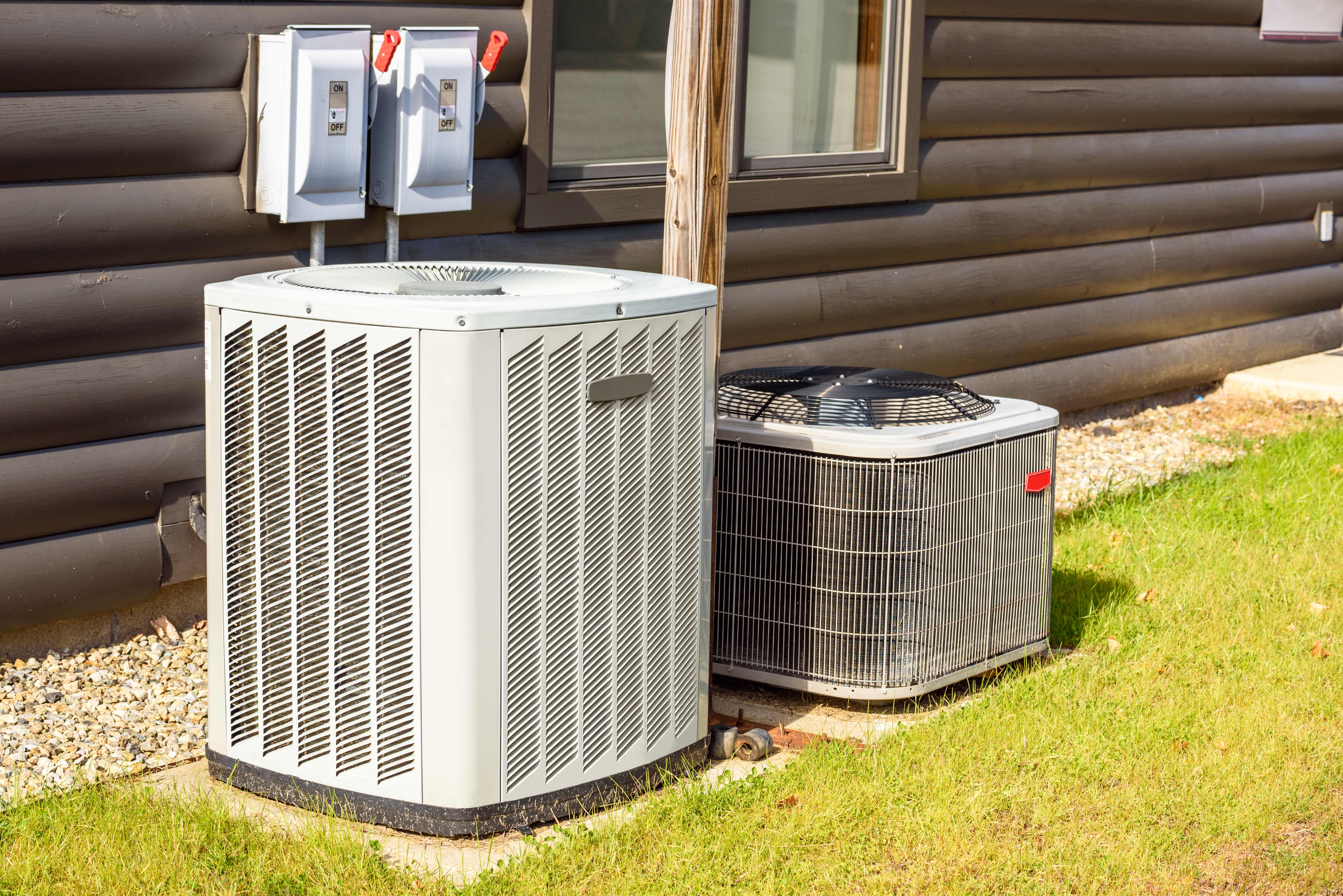 An HVAC unit in a backyard