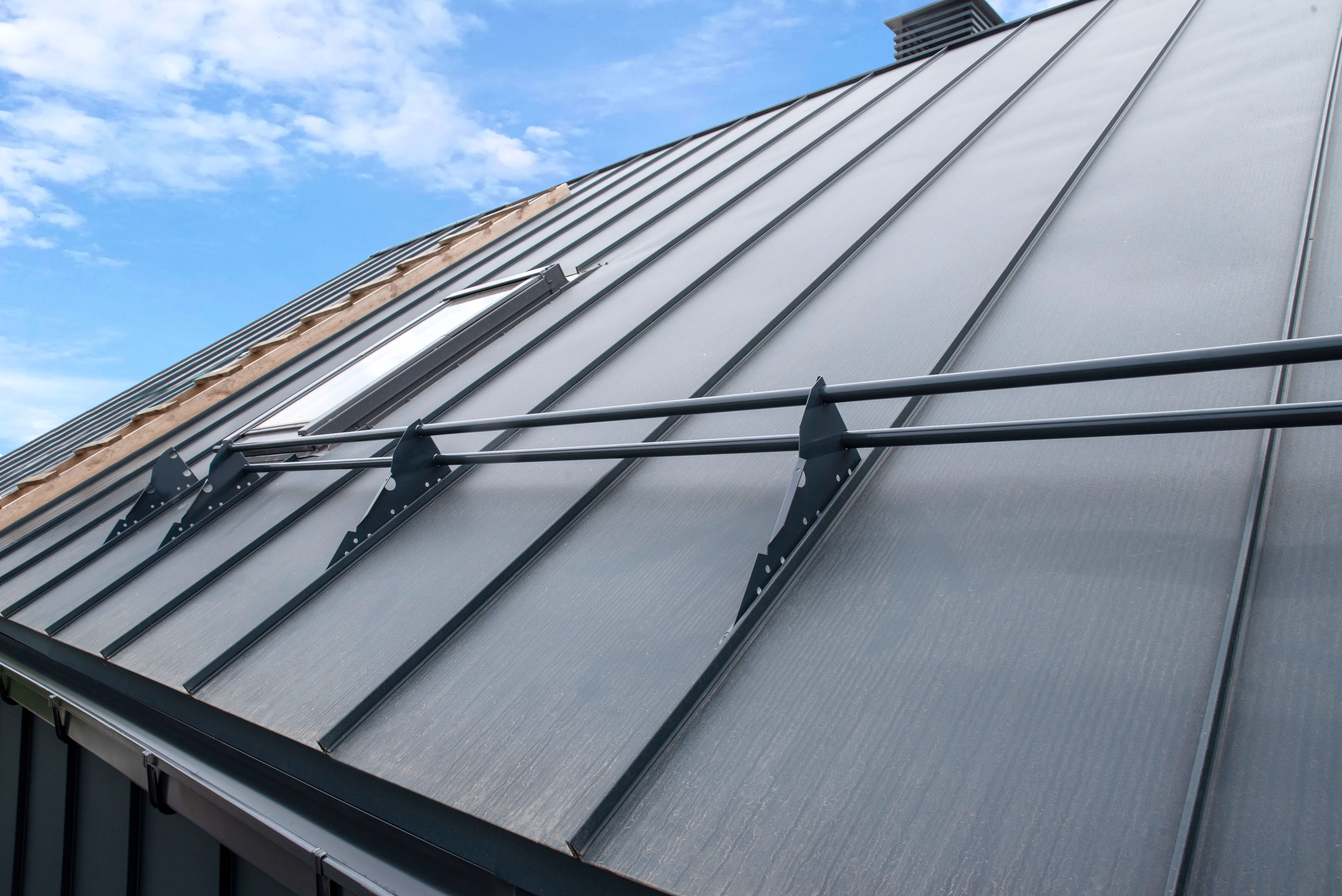 Snow guard railing installed on a metal roof