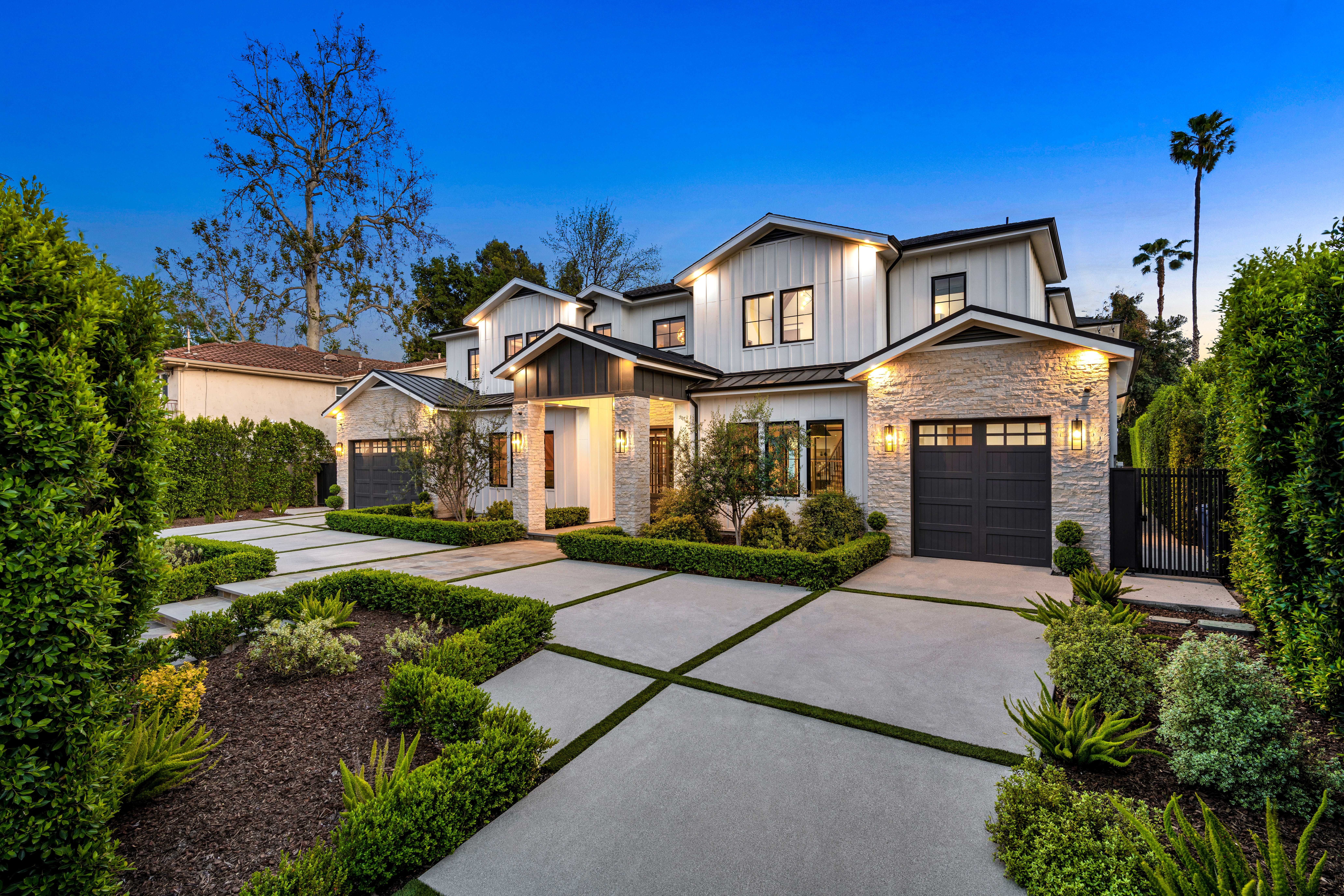 A modern suburban home with a well-maintained exterior is evaluated during a home appraisal to determine its market value.