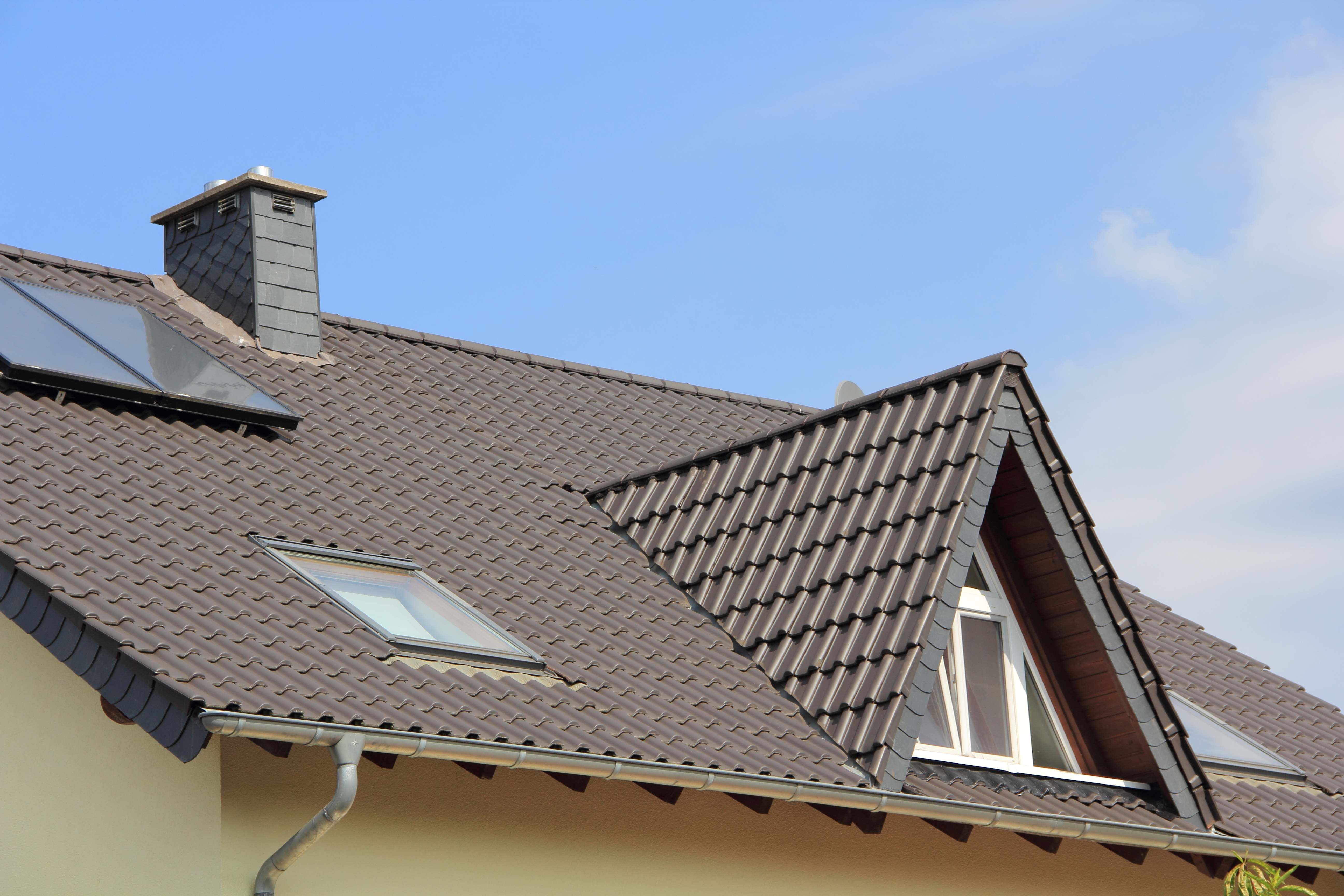 Dormer window and skylights on a metal roof
