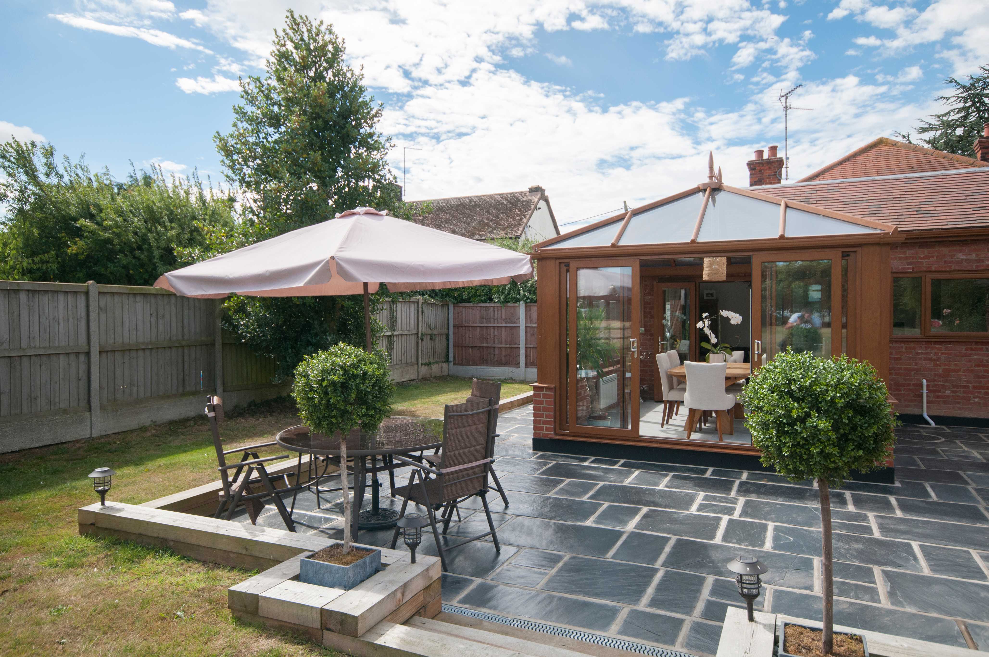 Spacious garden with a cozy patio