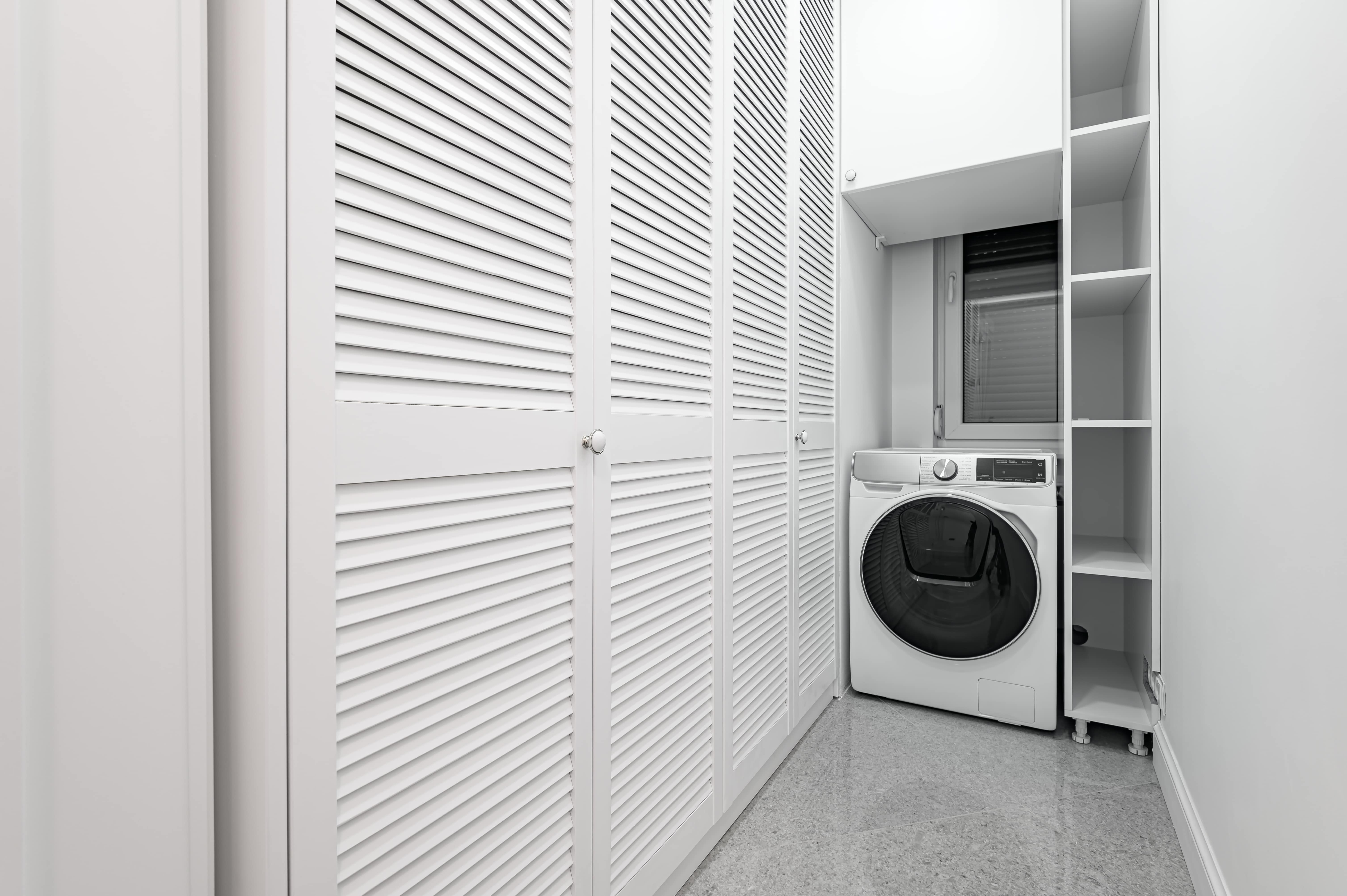 White utility room with wardrobe