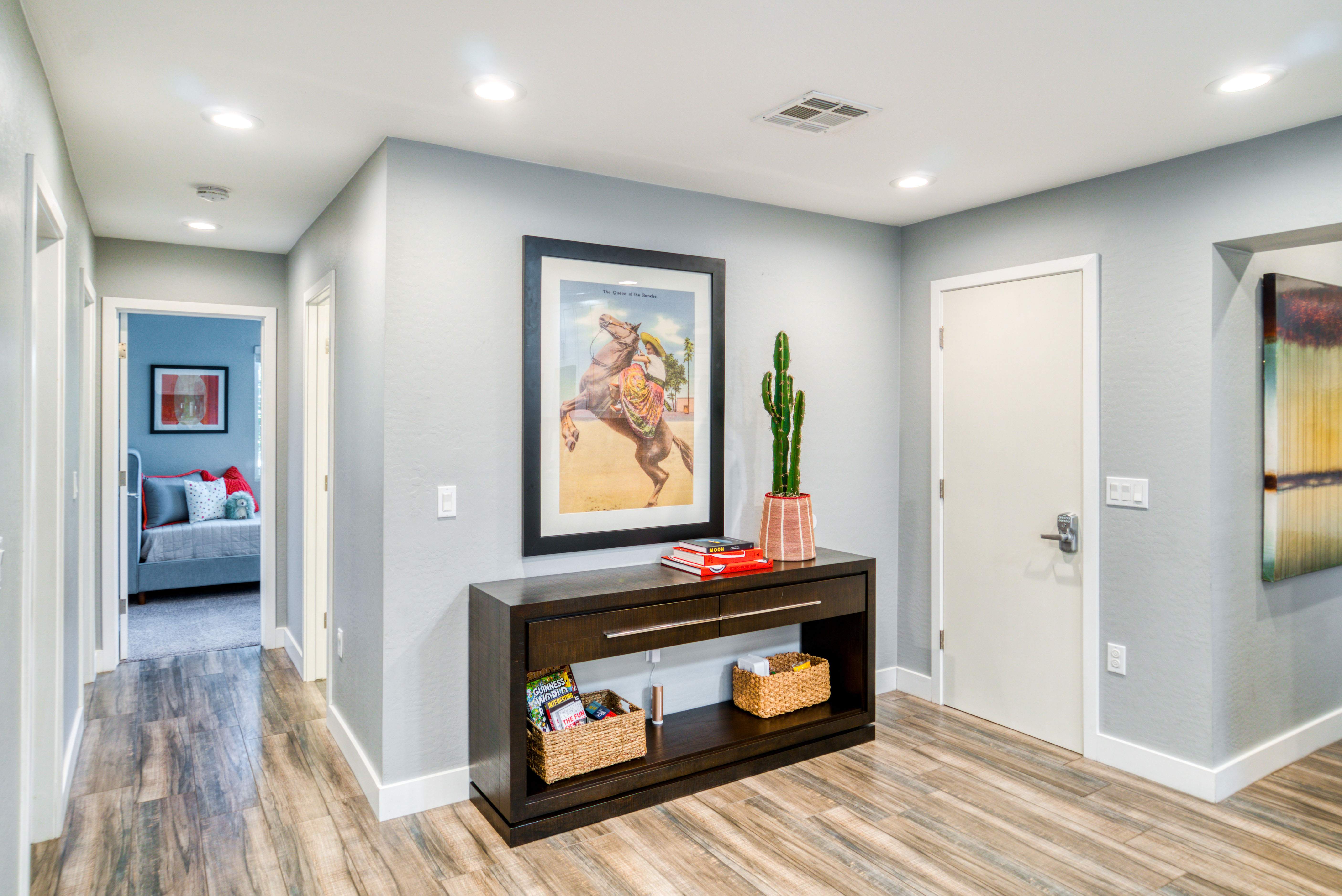hallway with large picture above table