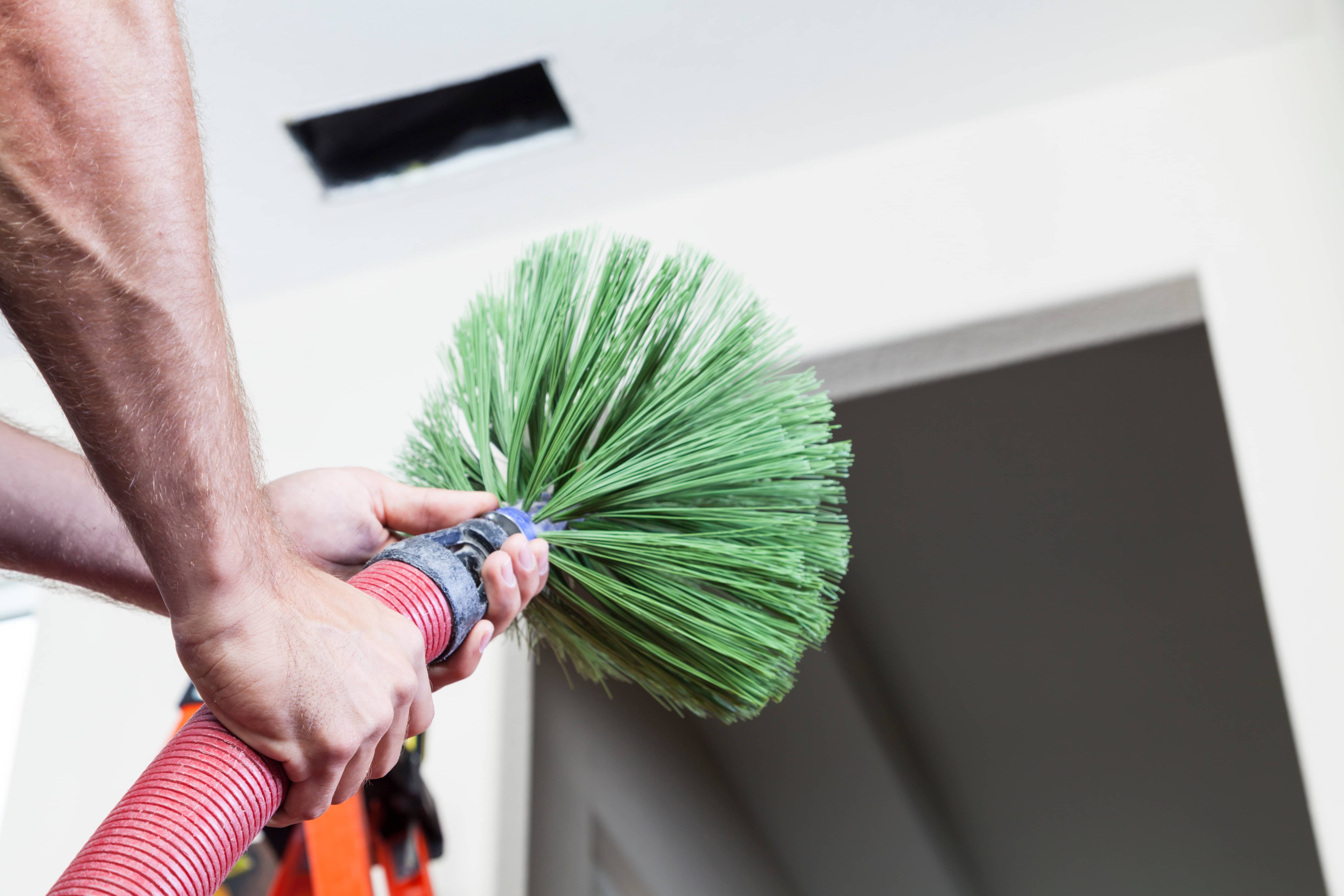 Close-up of cleaning an air duct