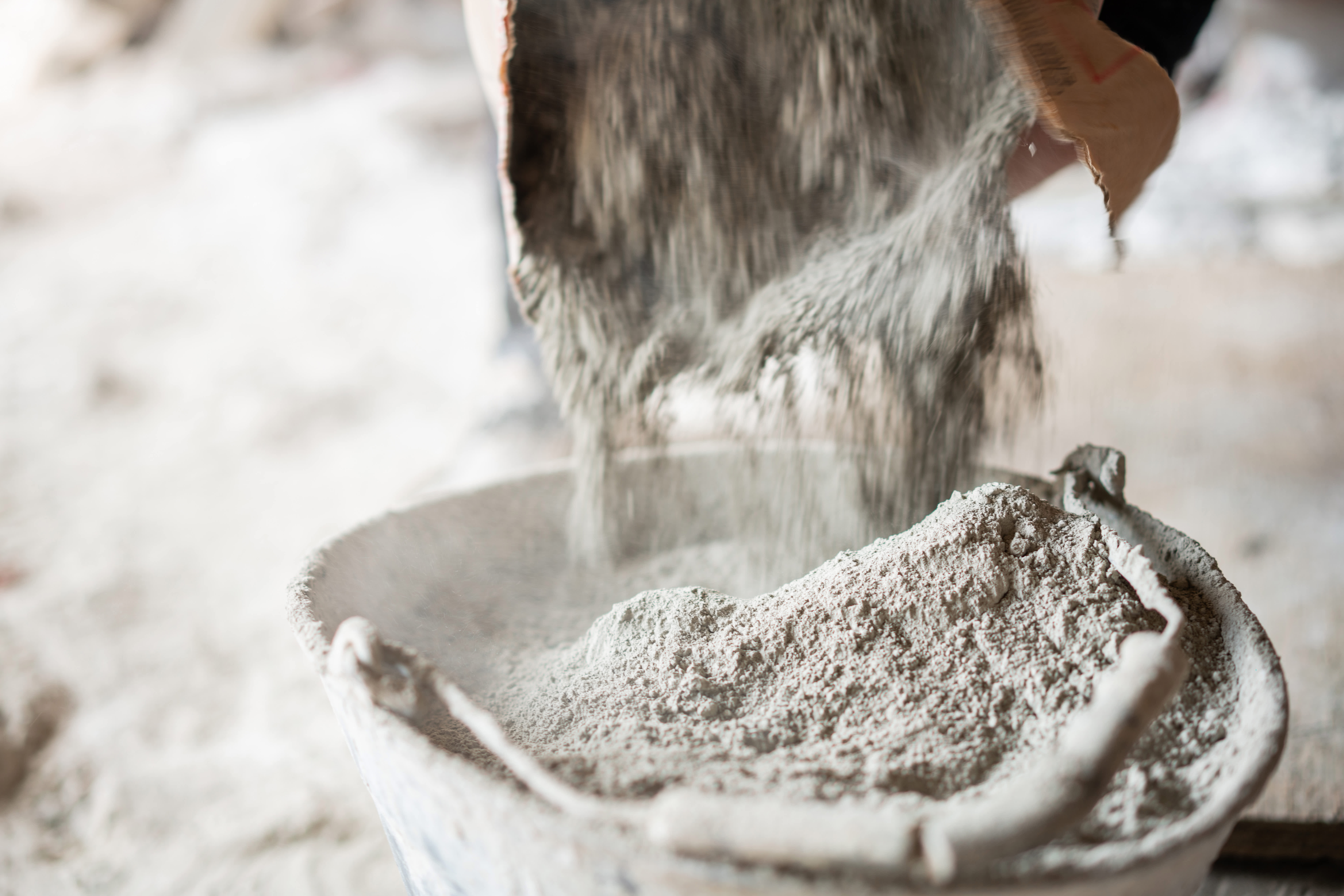 Filling a bucket with cement