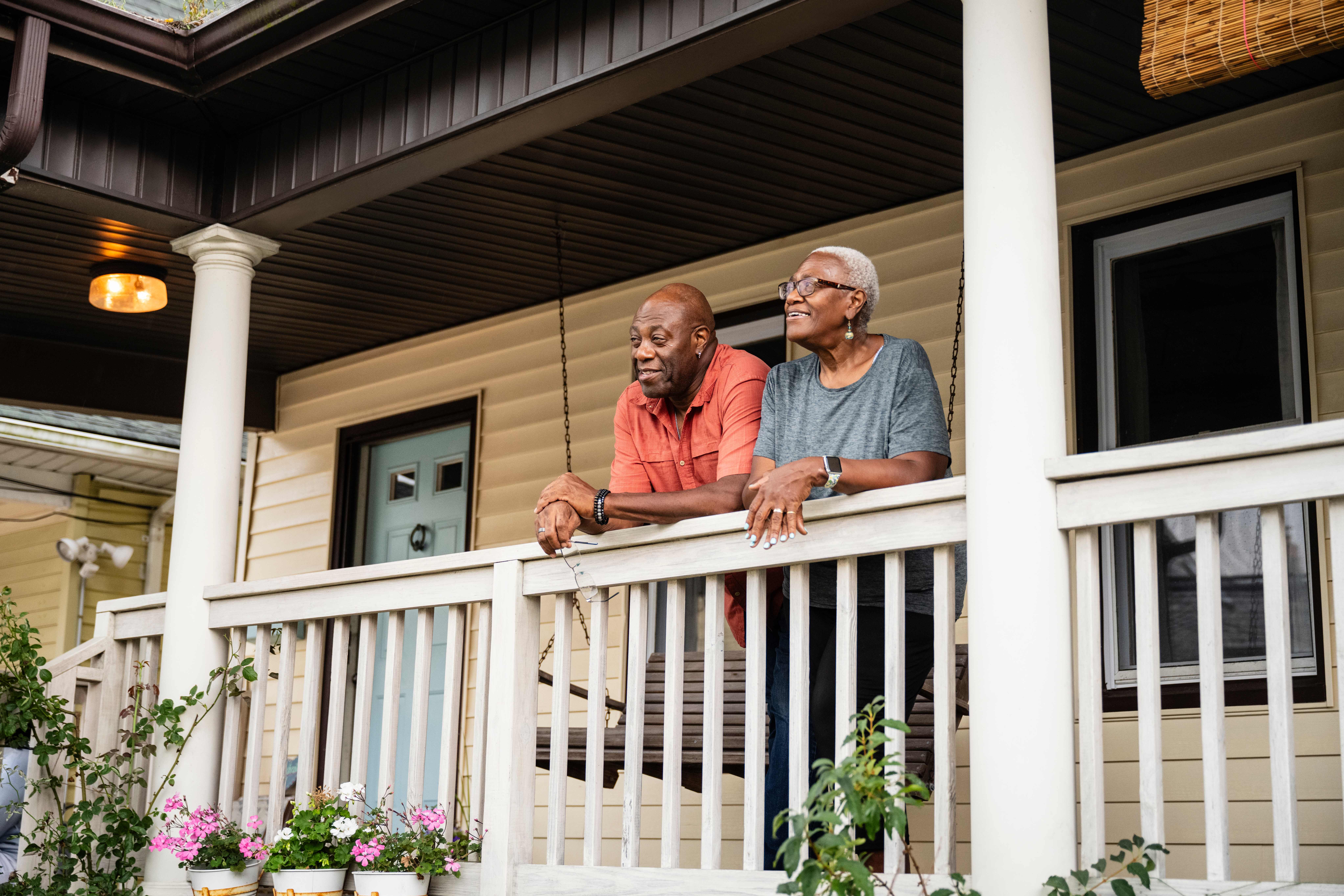 A senior couple relaxing on their porch
