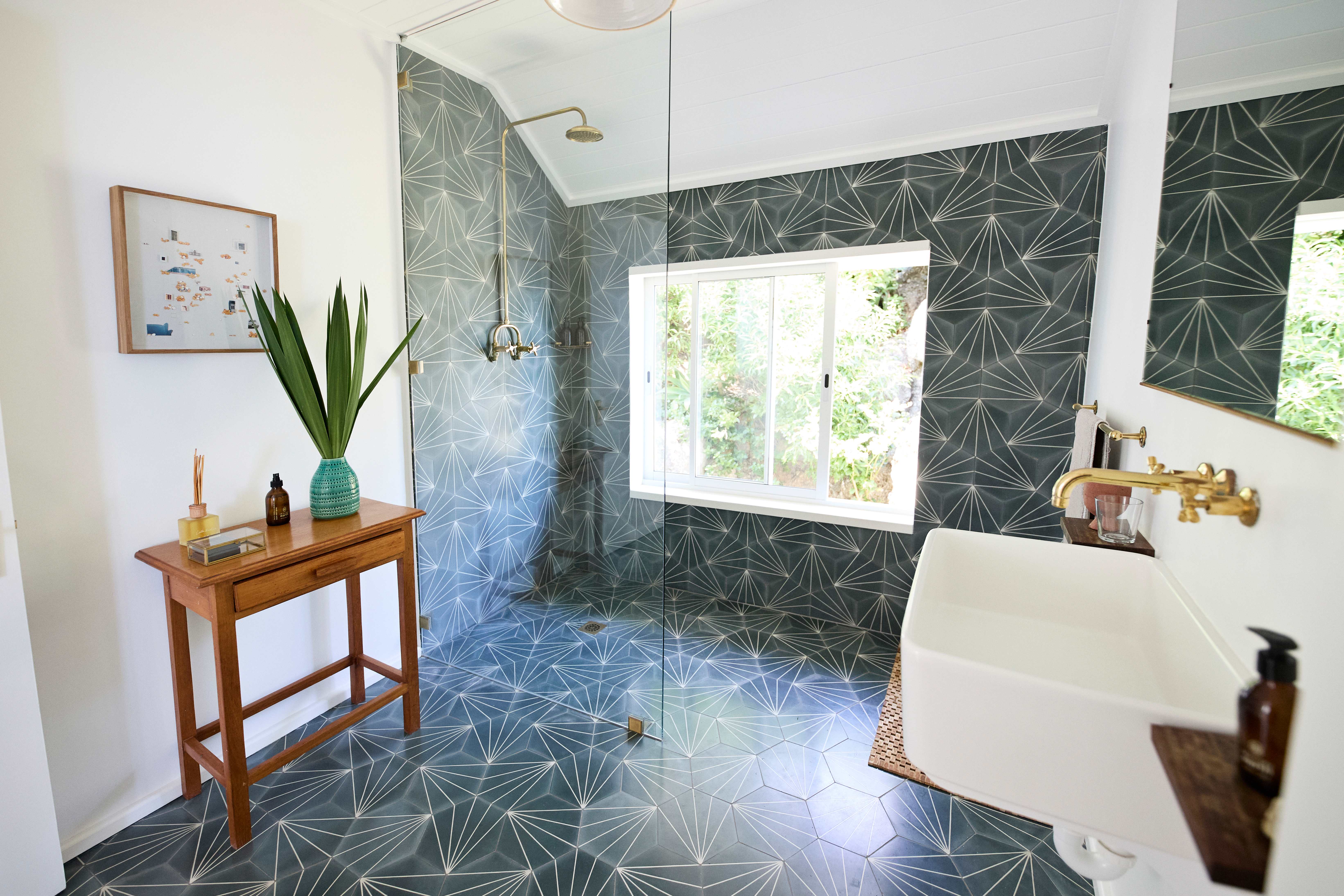 Modern bathroom with a curbless shower and green tile