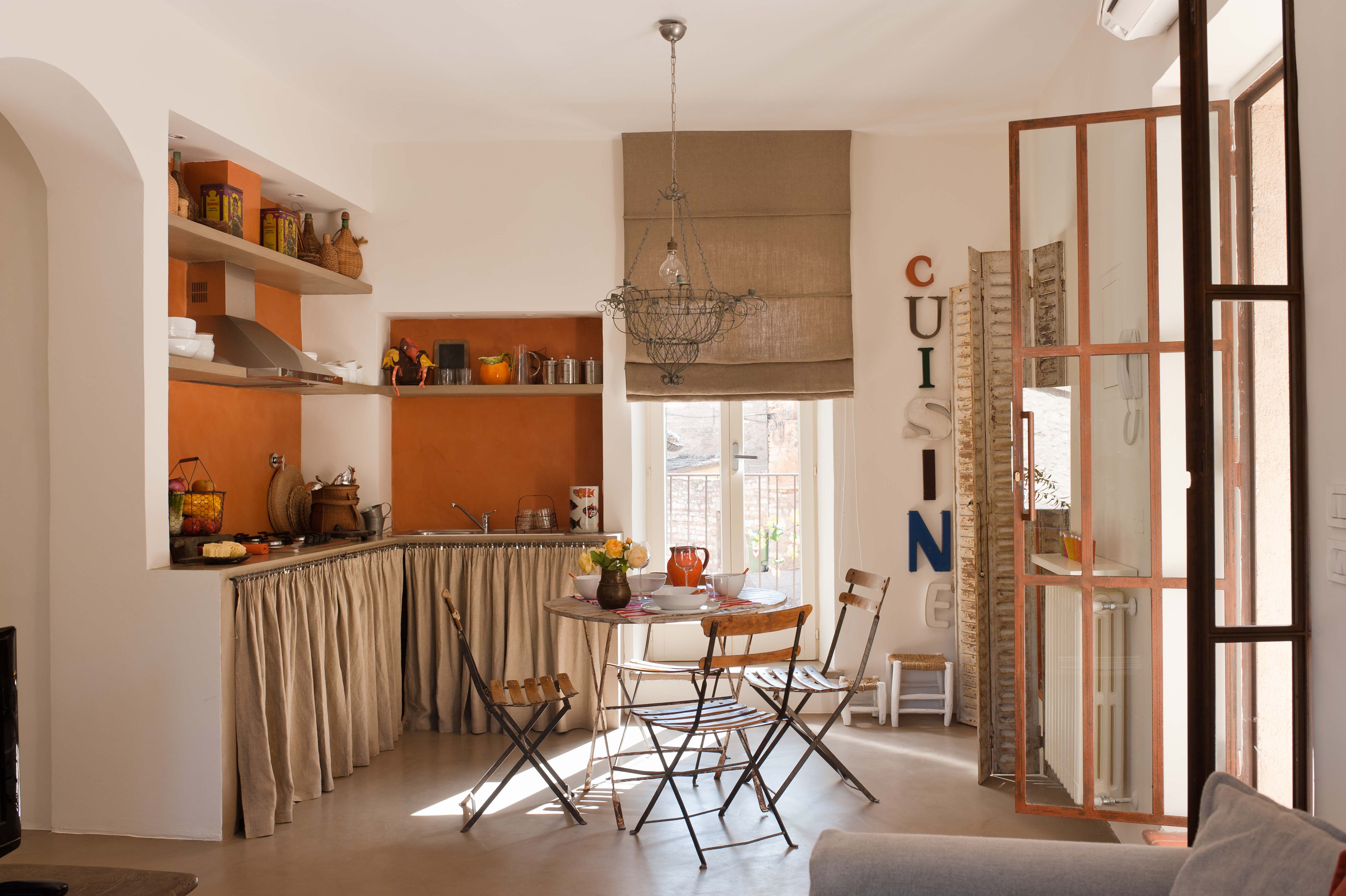 A small kitchen with a collapsible table