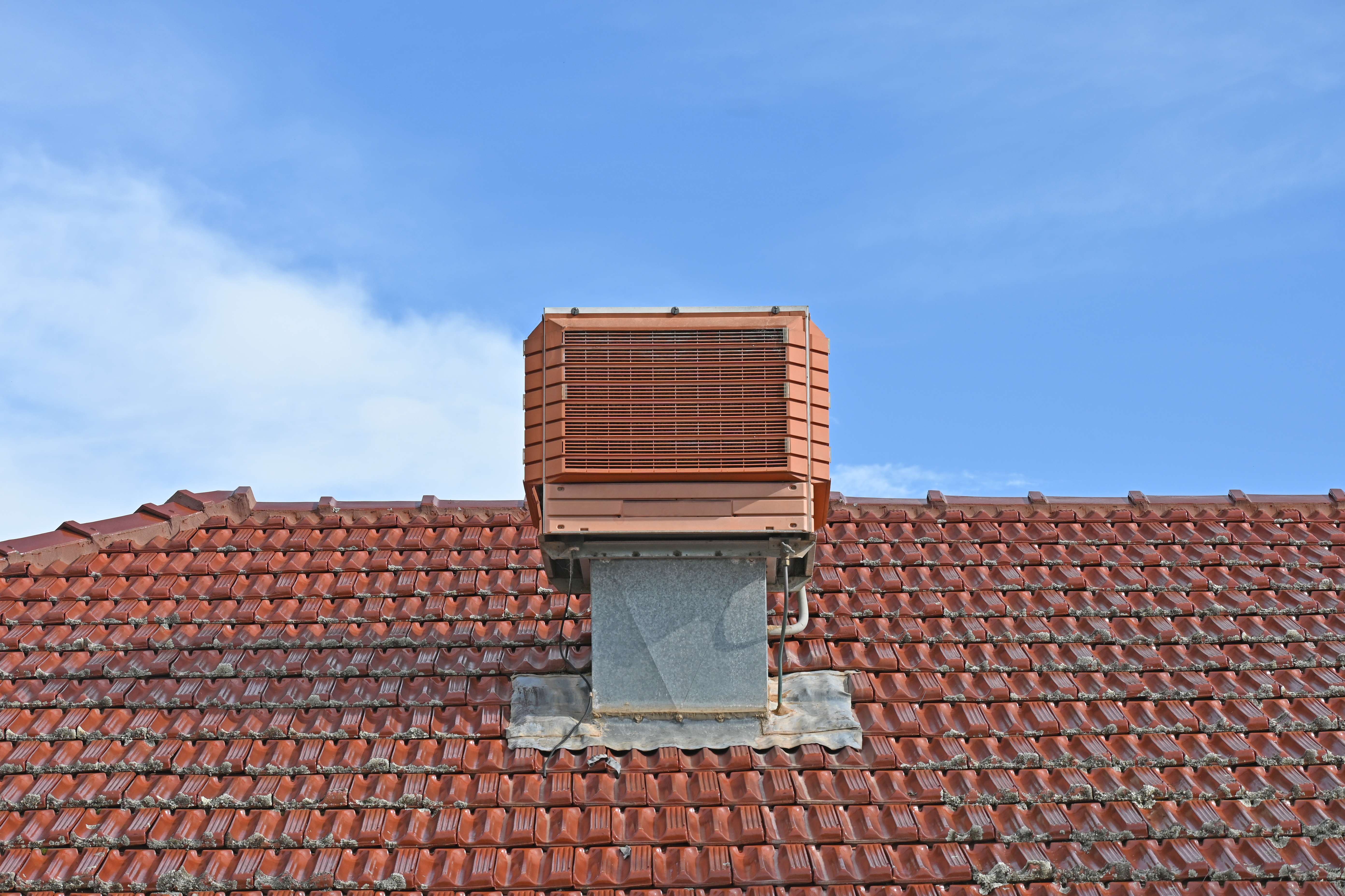 An evaporative cooler on the roof