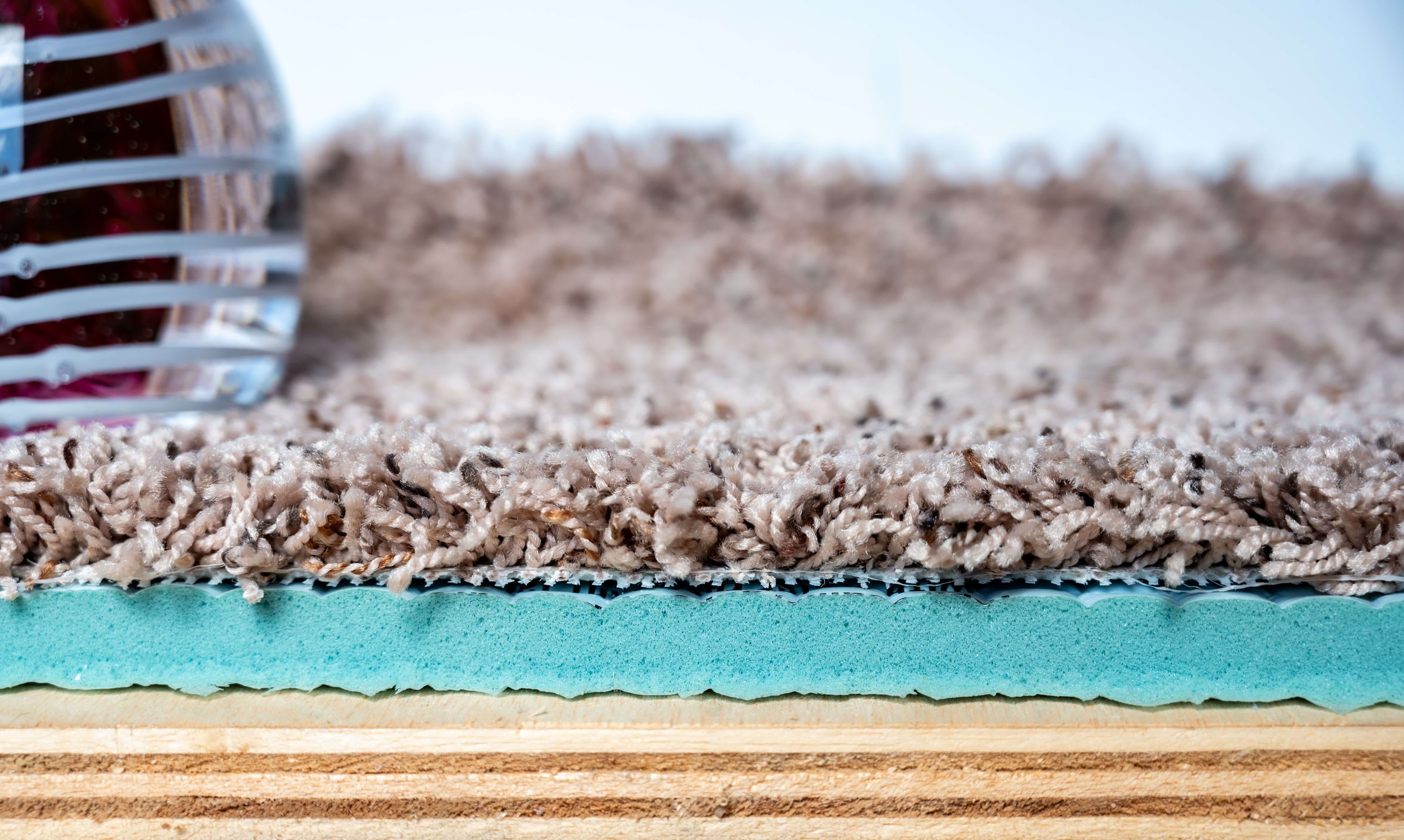 Layers of carpet, memory foam padding and plywood